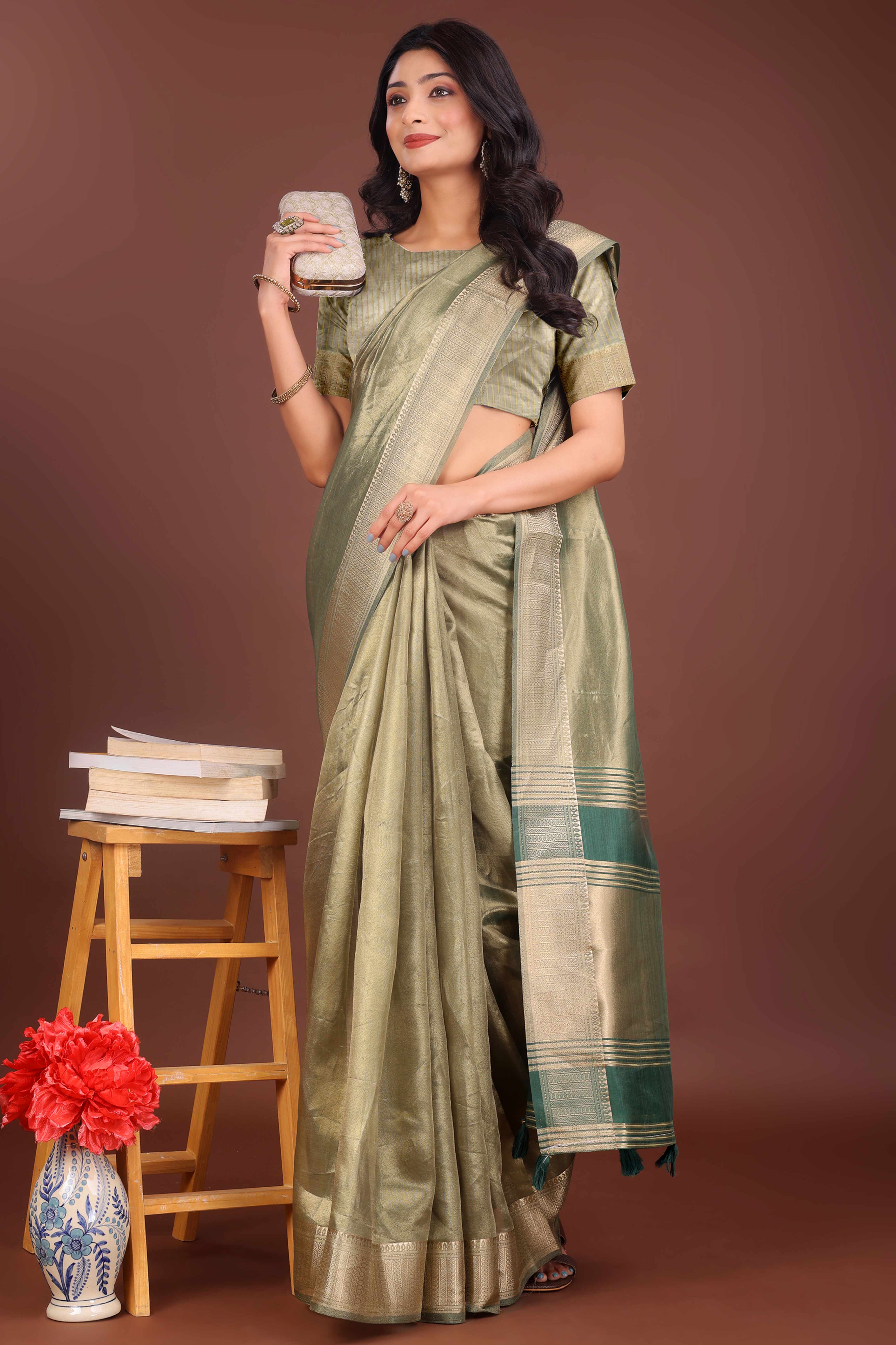Green Organza Solid Saree With Lustrous Zari Weave &  Delicate Tassels