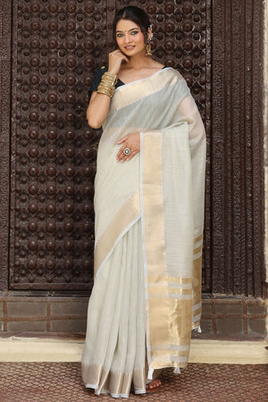 Charming Grey Zari Weaving Cotton Blend Saree Adorned With Stylish Tassel Detailing