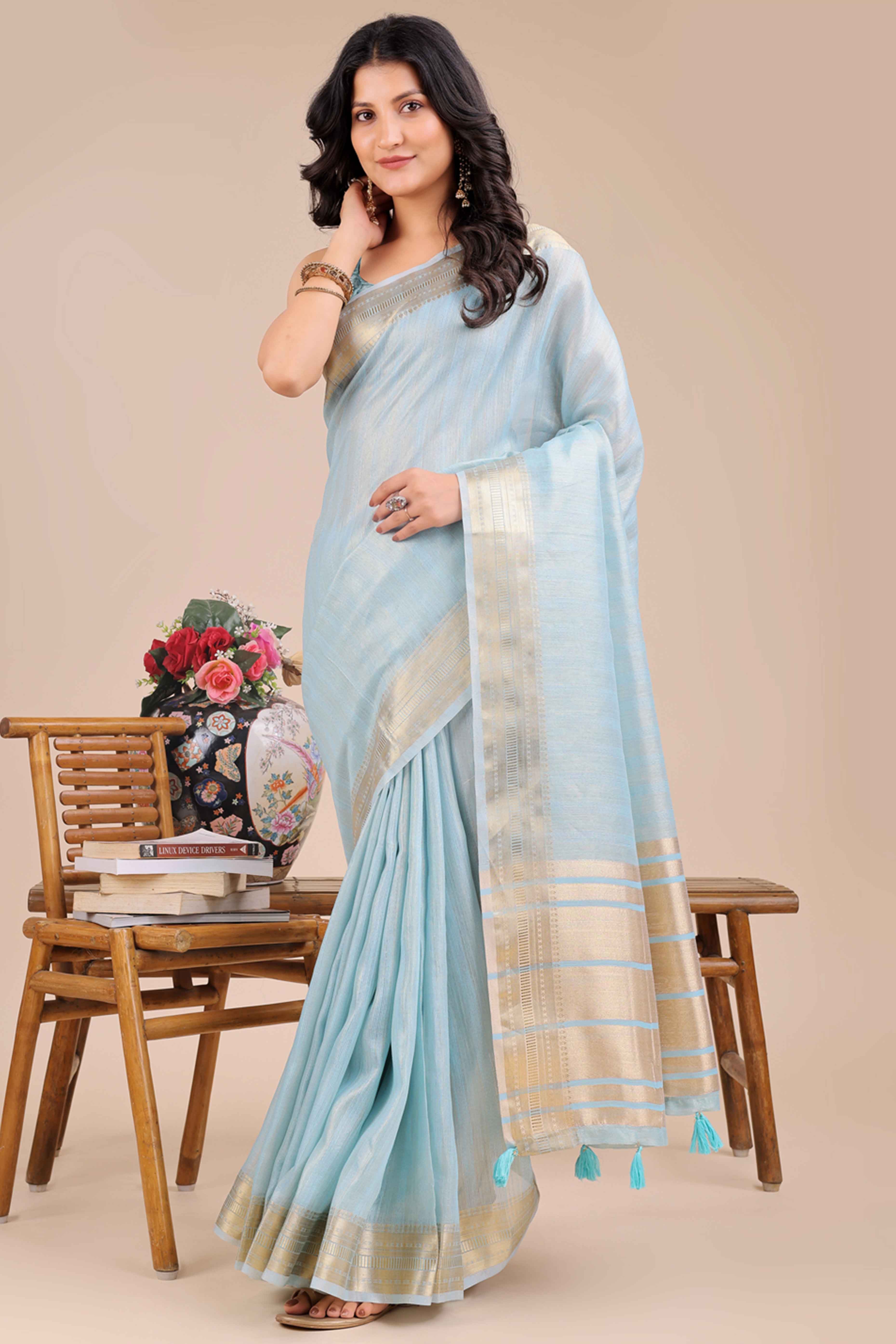 Sky Blue Organza Saree With Intricate Weave & Elegant Tassel Accents