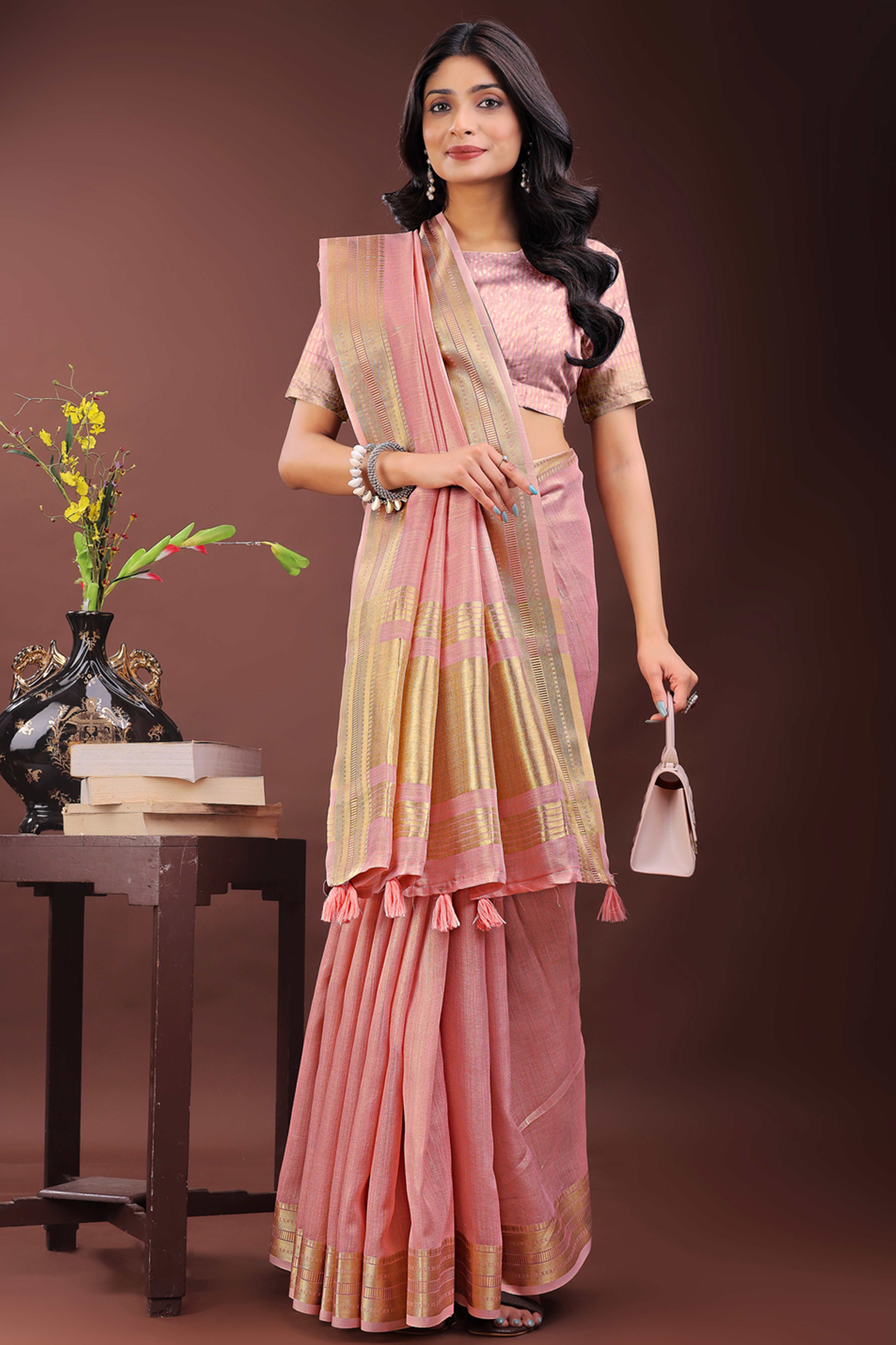 Light Pink Organza Saree Adorned With Zari Weave & Tassel Edges