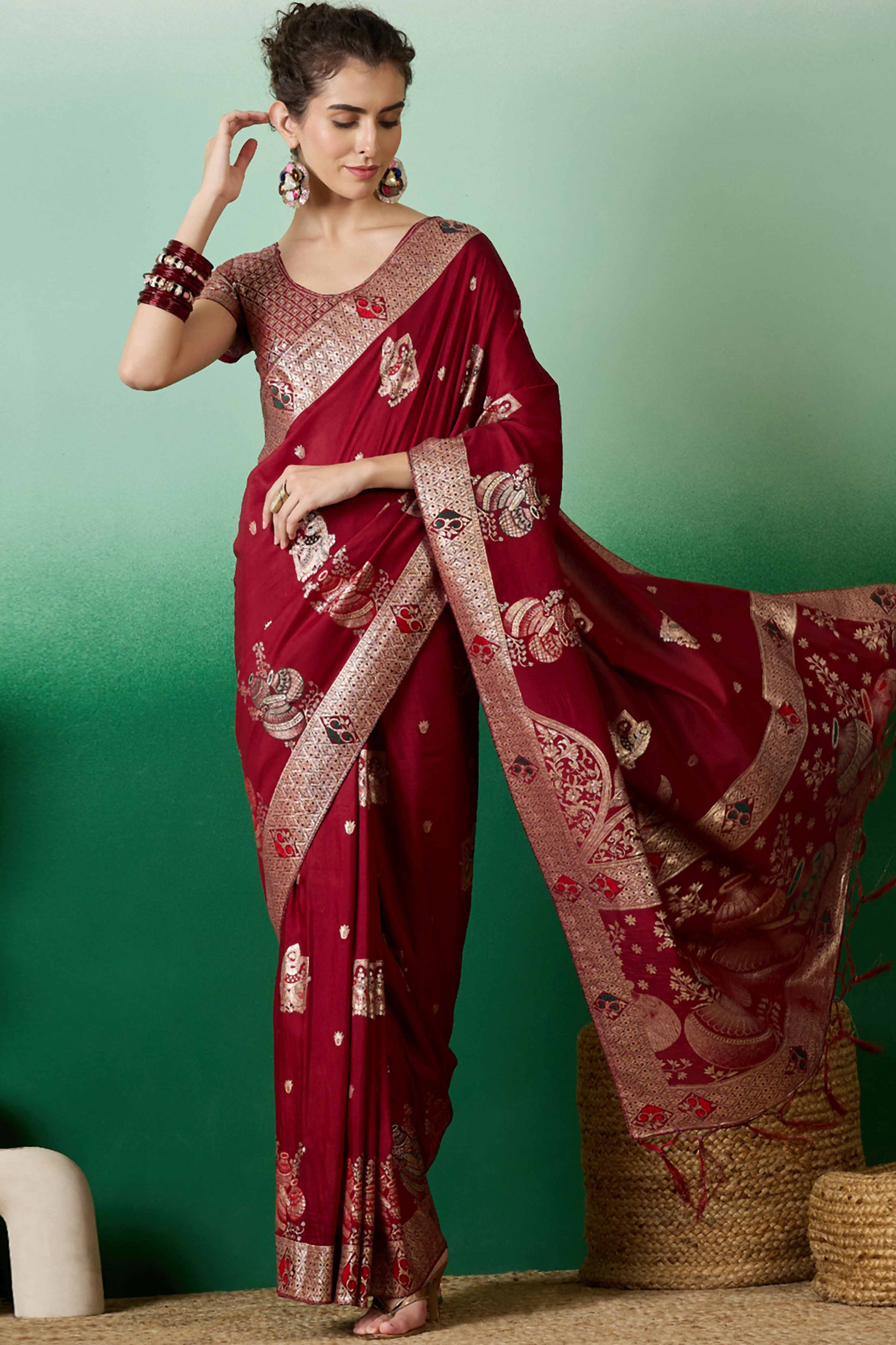 Maroon Cotton Blend Saree Adorned With Floral Zari Weaving & Soft Tassel Accents