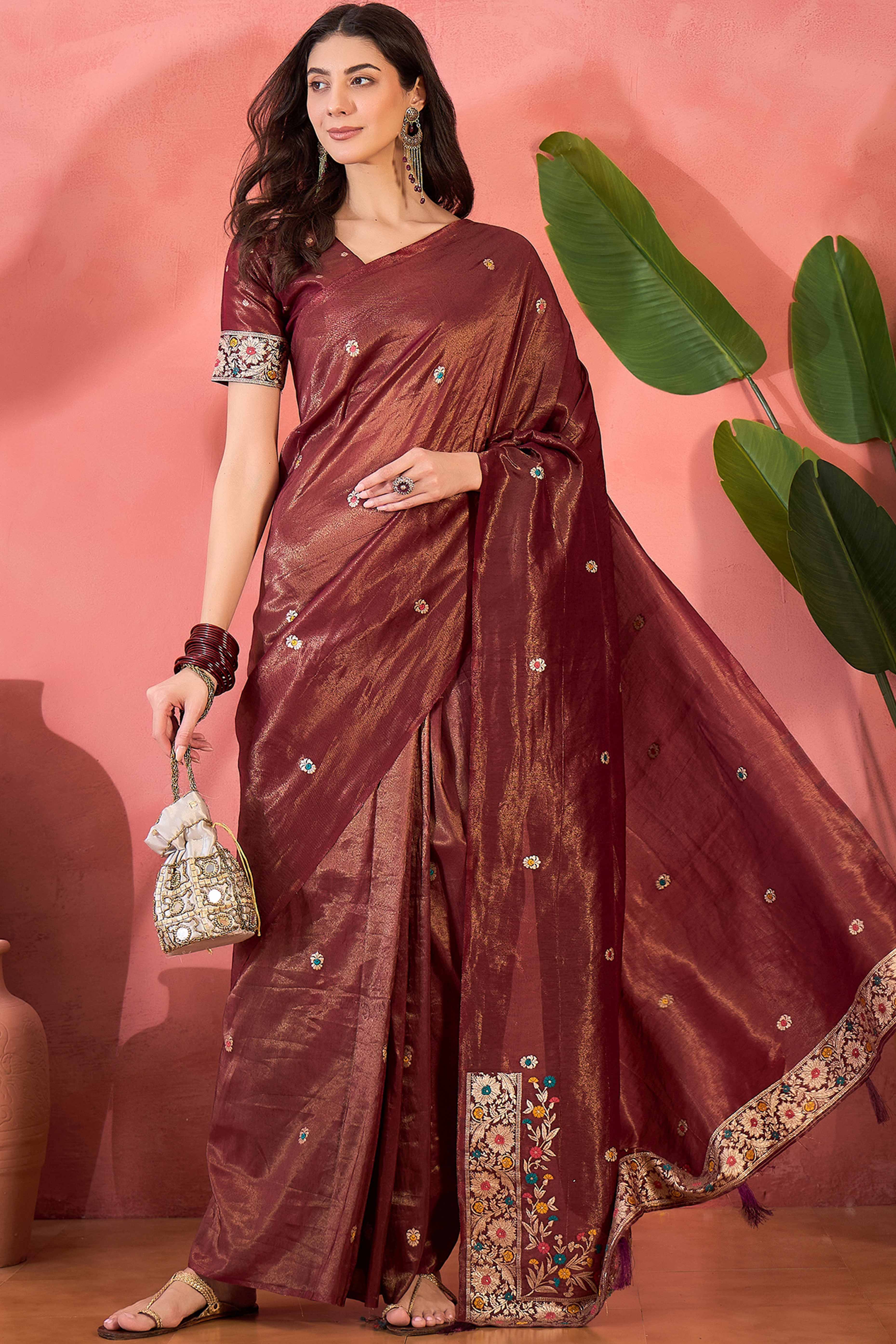 Maroon Zari Woven Shimmer Saree With Floral Motifs & Flowing Tassel Pallu
