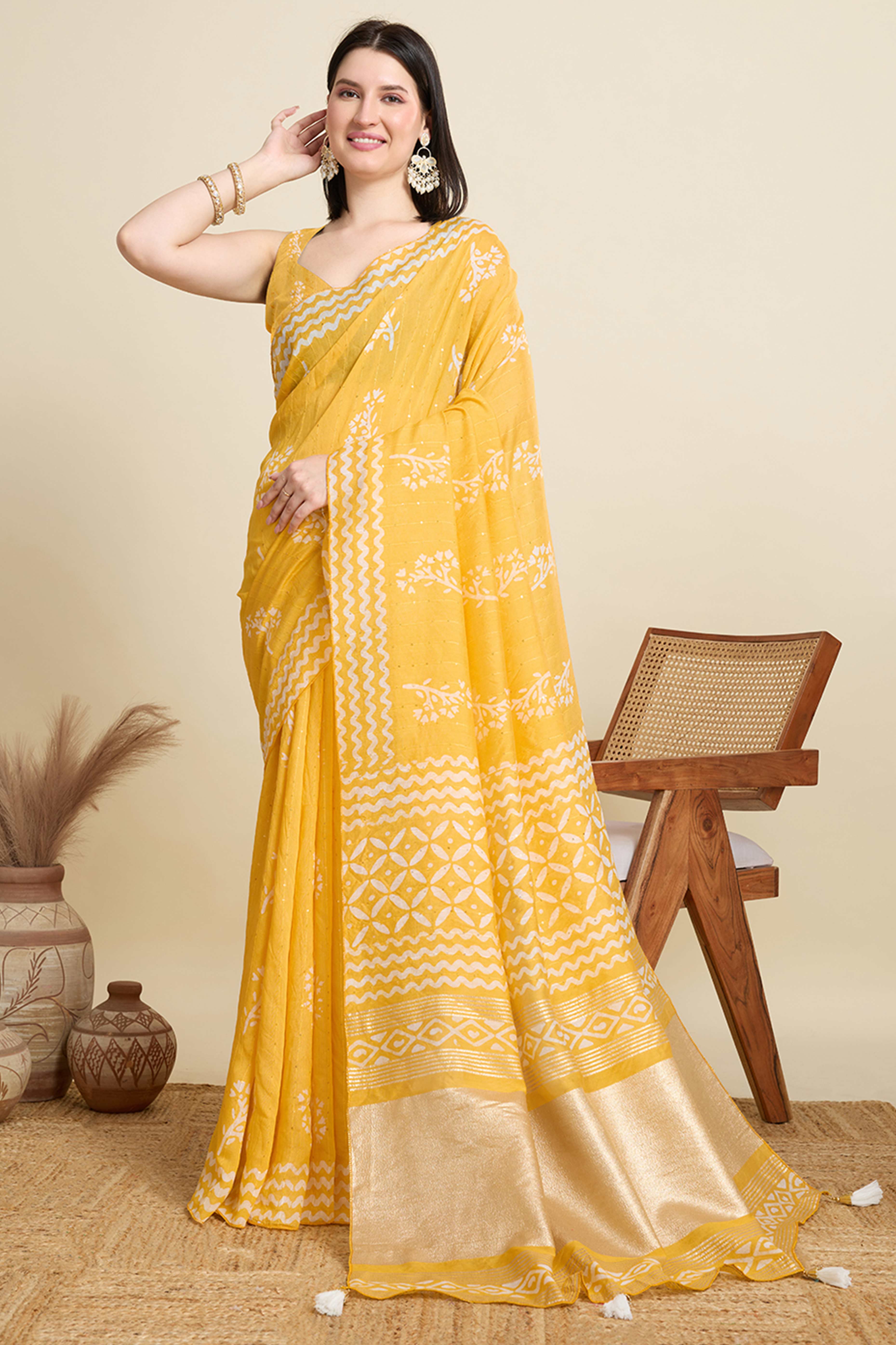 Yellow Cotton Blend Saree Featuring Floral Prints and Elegant Sequins Work Accents
