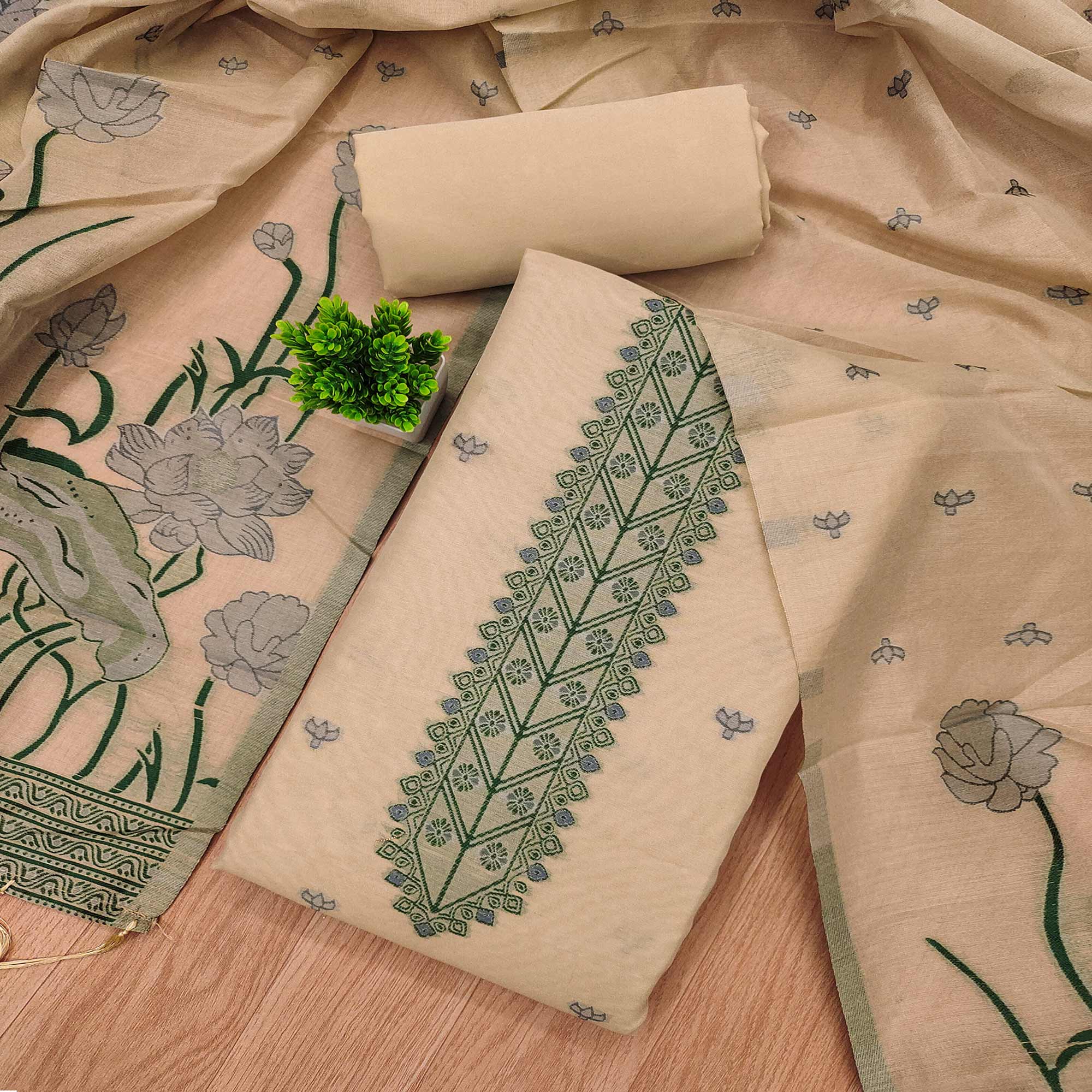 Chikoo Ethnic Dress Material Showcasing Handloom Style Floral Zari Weaving