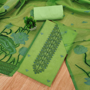 Green Ethnic Dress Material Showcasing Handloom Style Floral Zari Weaving