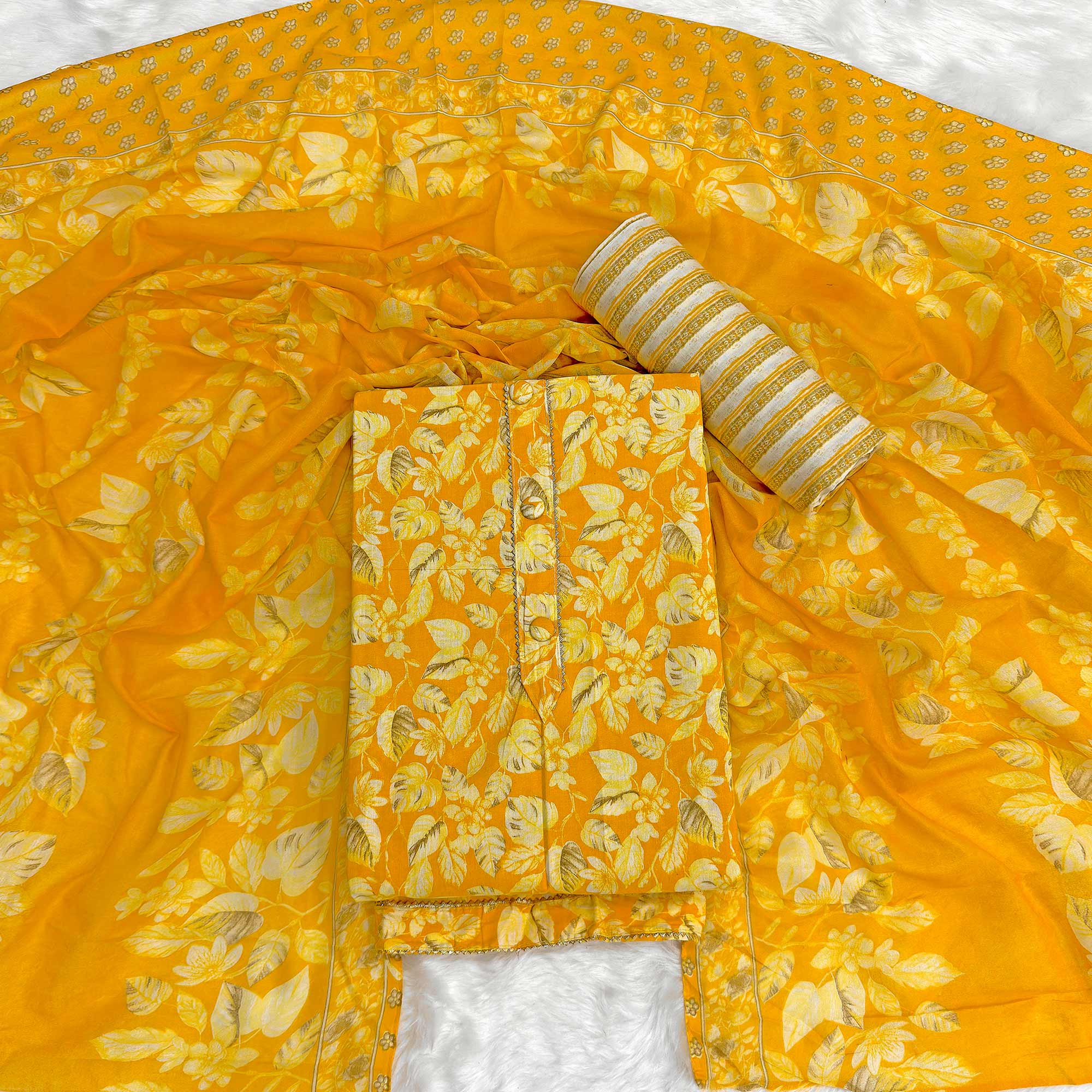 Charming Mustard Pure Cotton Dress Material Featuring Floral Print With Tie On Neck & Fancy Button