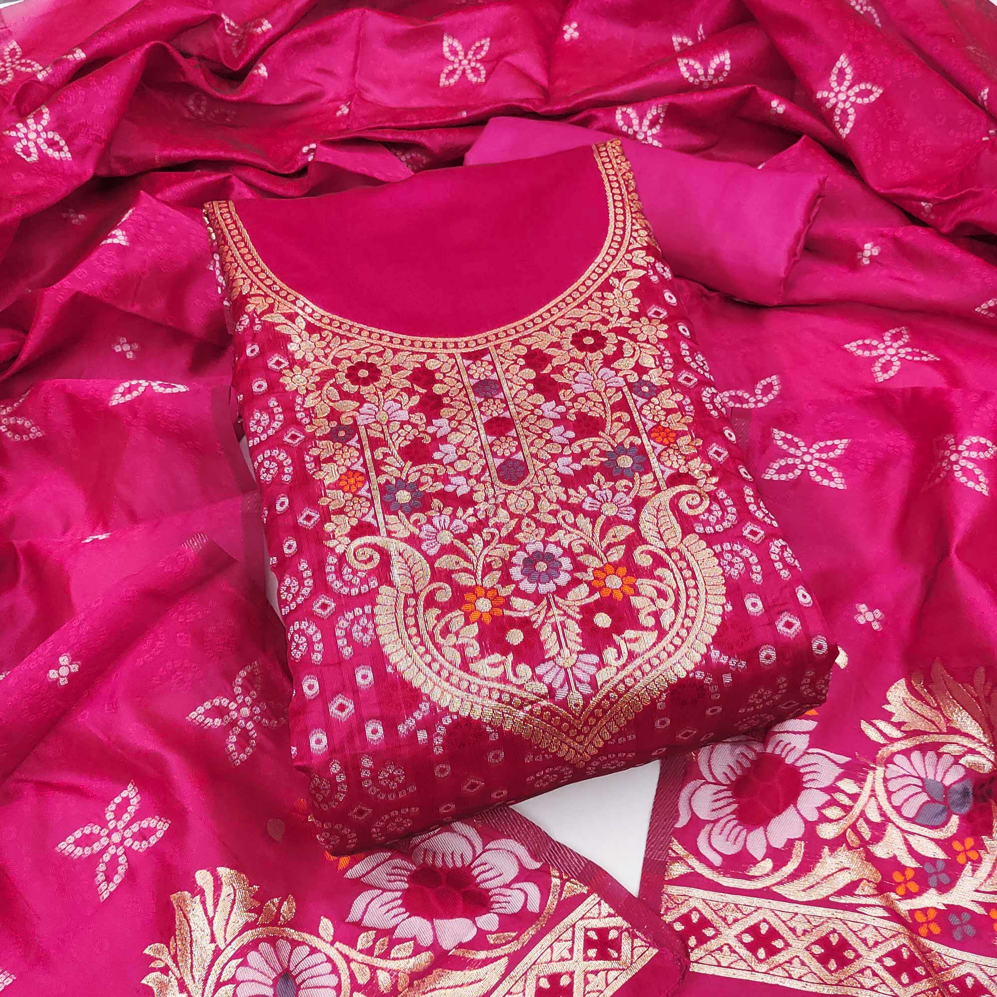 Rani Pink Banarasi Silk Jacquard Dress Material Adorned With Intricate Floral Zari Weaving