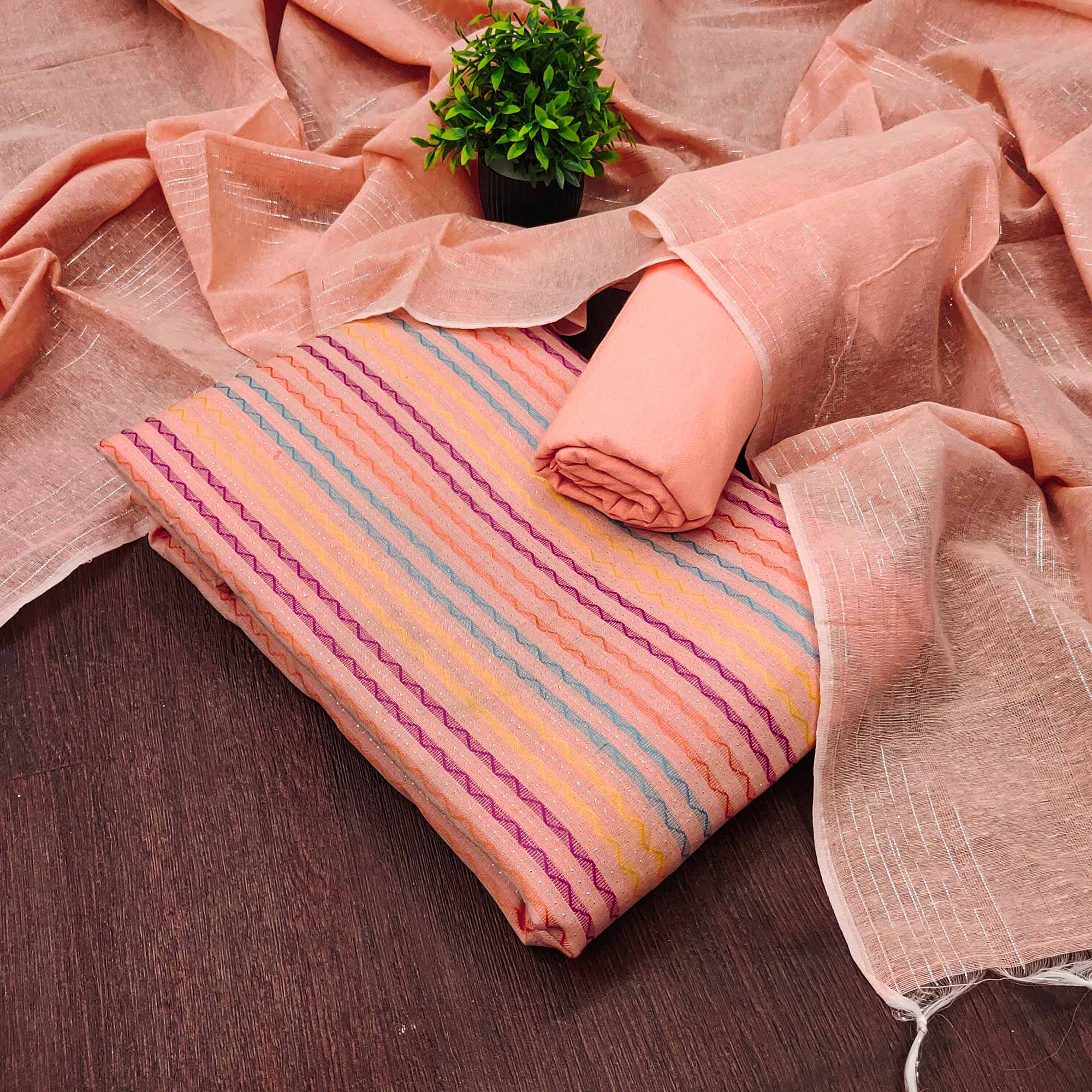Peach Poly Cotton Blend Dress Material Highlighted With Striped Woven Work