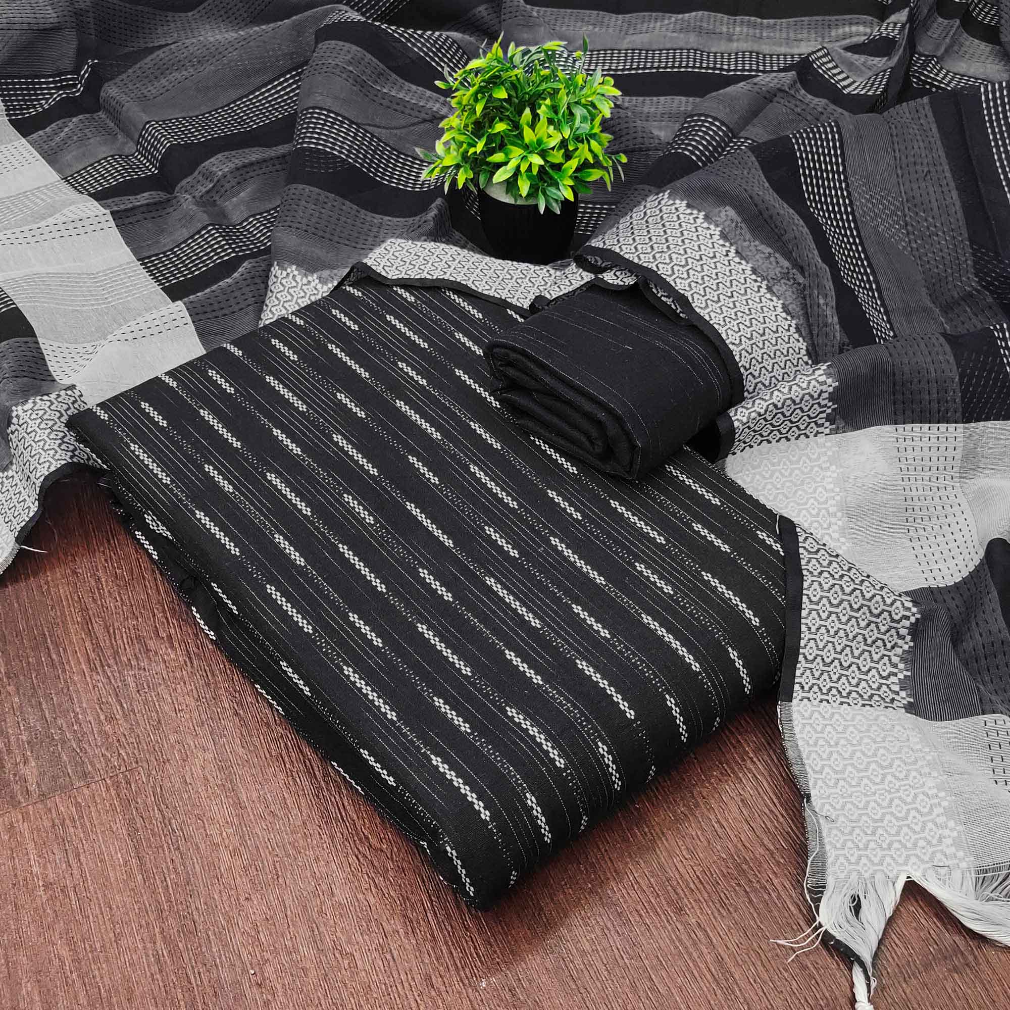 Black Poly Cotton Blend Dress Material Adorned With Striped Weaving Work