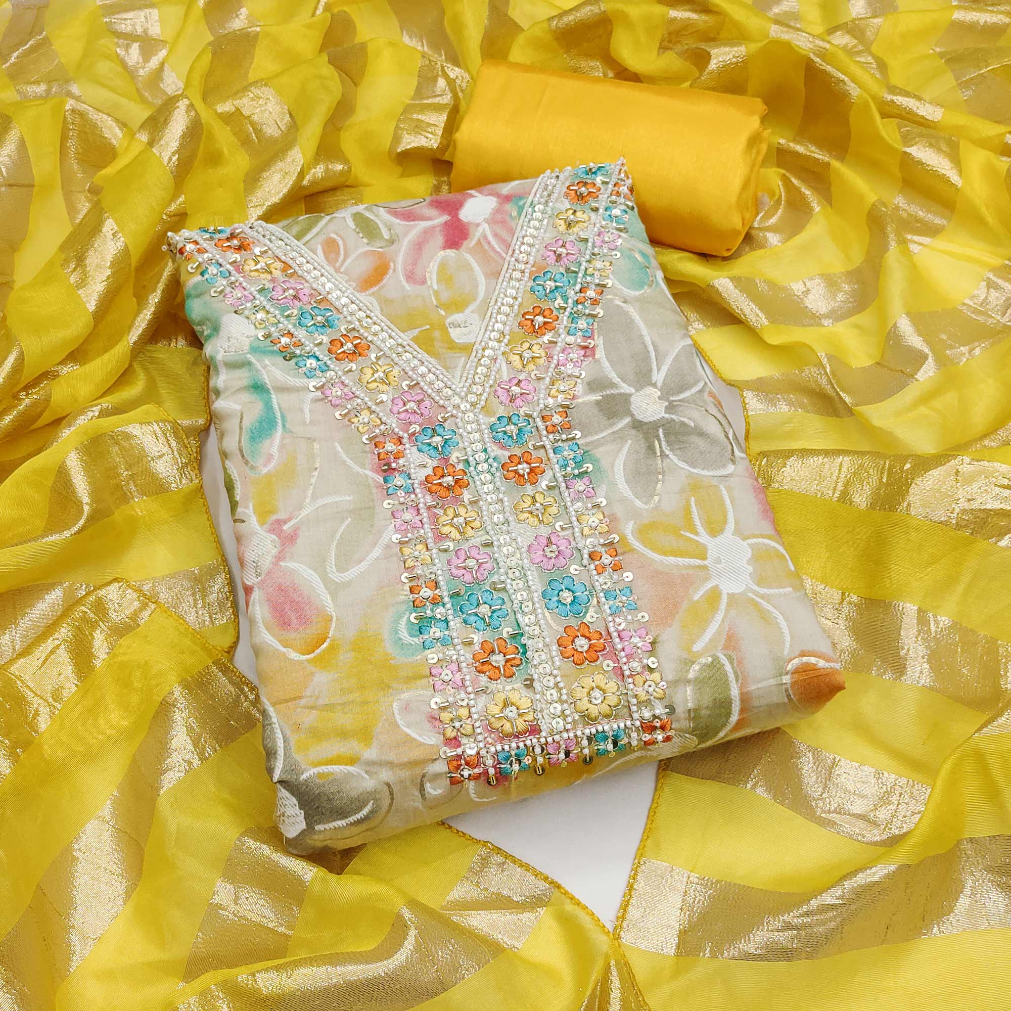 Vibrant Yellow Floral Printed Roman Art Silk Dress Material Adorned With Sparkling Beads & Sequins