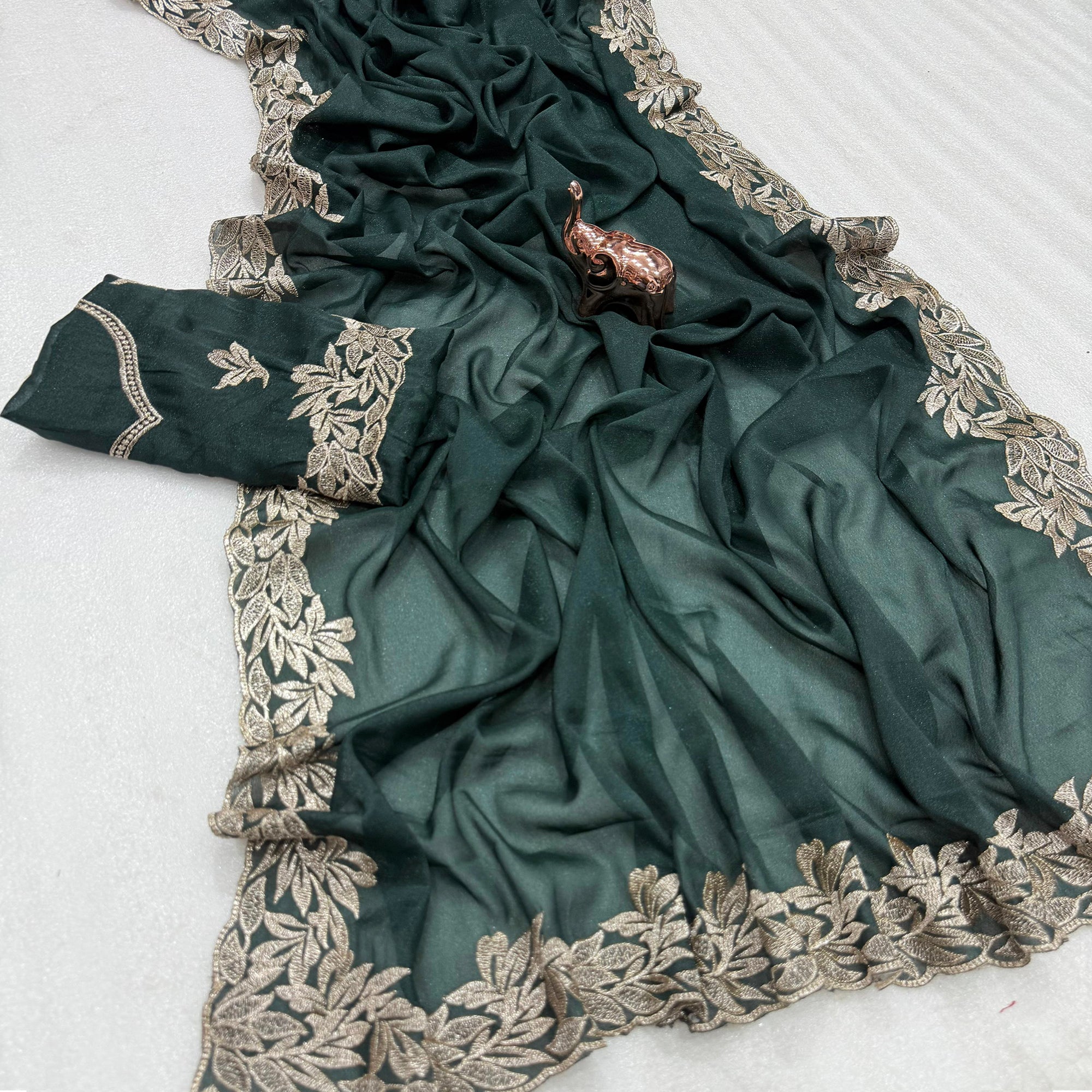 Stylish Dark Green Star Chiffon Saree with Traditional Zari Embellished Border