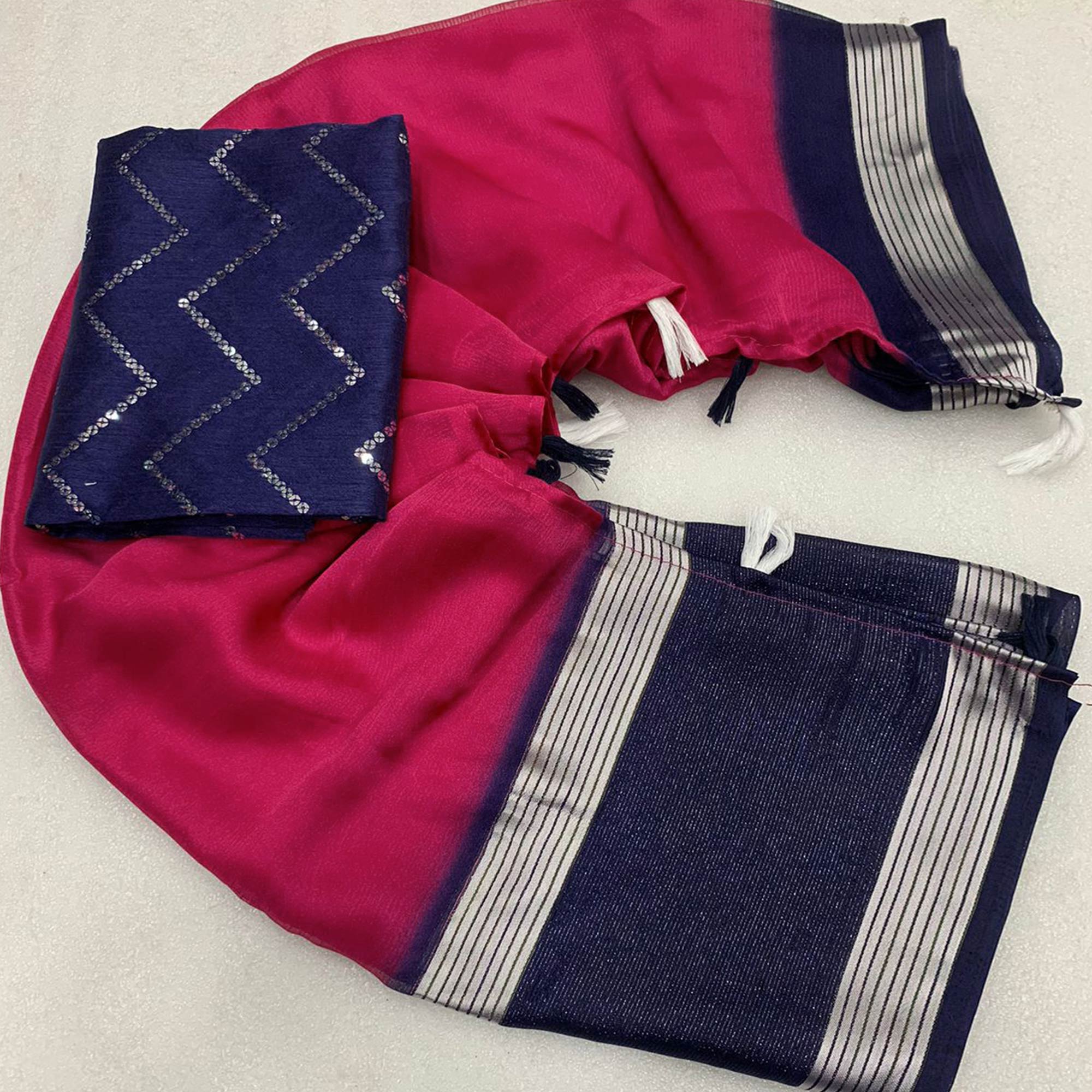 Rani Pink Woven Chiffon Saree With Tassels