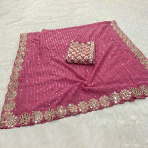 Stunning Pink Georgette Party Wear Saree Adorned with Heavy Sequins Embellishment