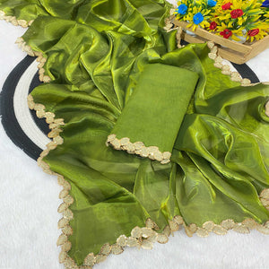 Green Tissue Saree Featuring Solid Finish and Delicate Lace Work by Jimmy Choo Style