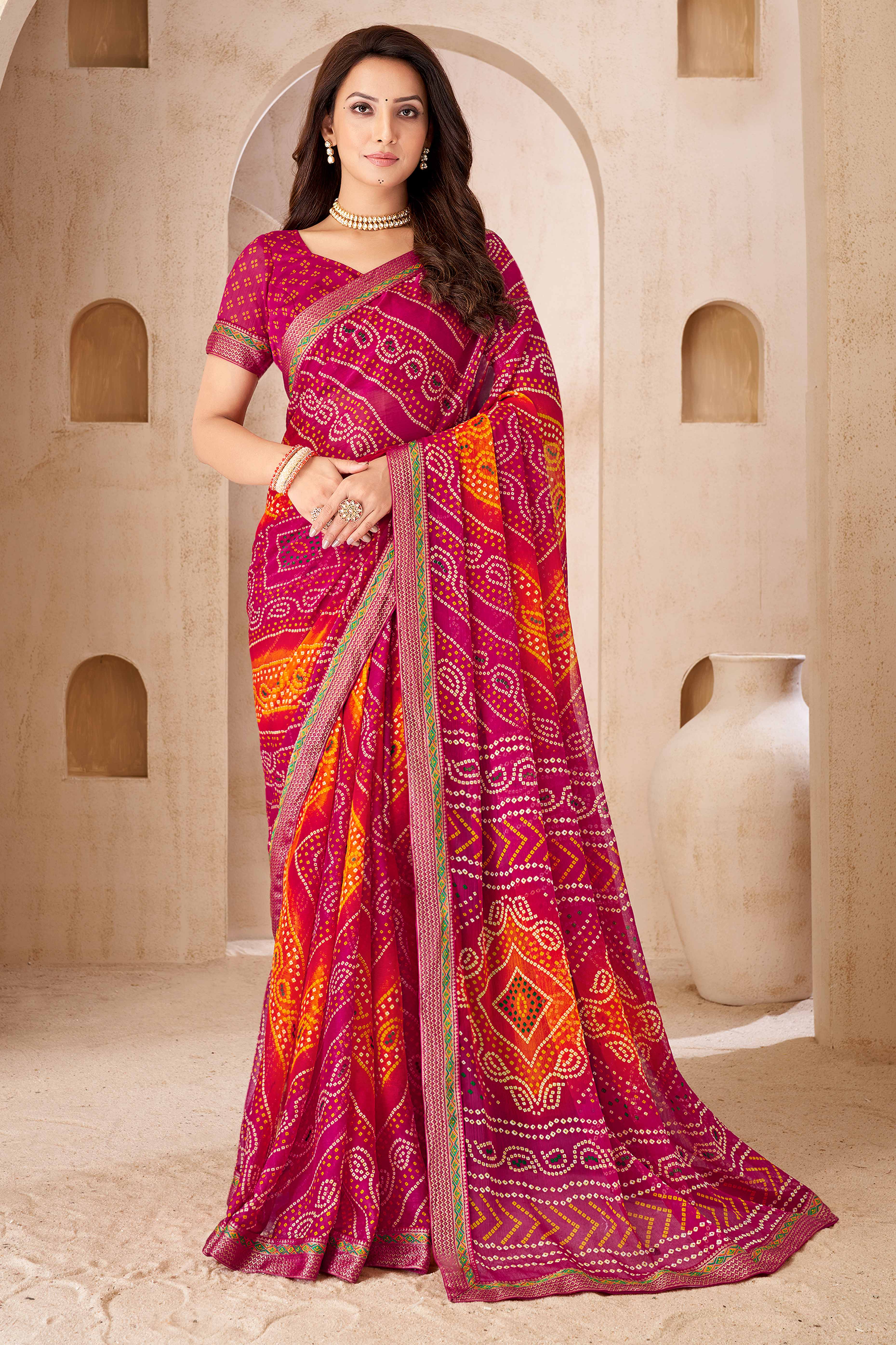 Magenta & Orange Bandhani Printed Chiffon Saree Enhanced with Delicate Lace Border Work