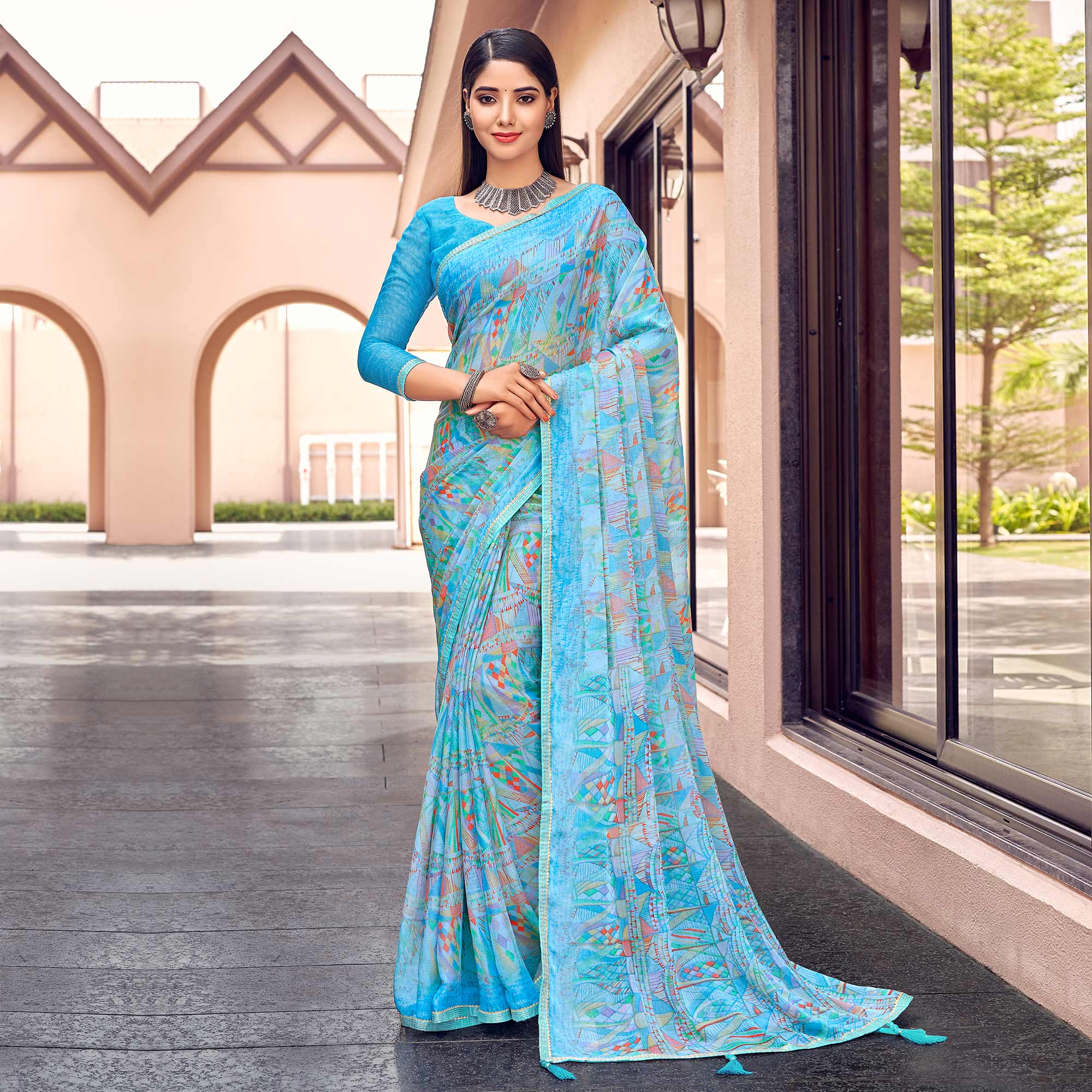 Blue Printed Chiffon Saree With Tassels