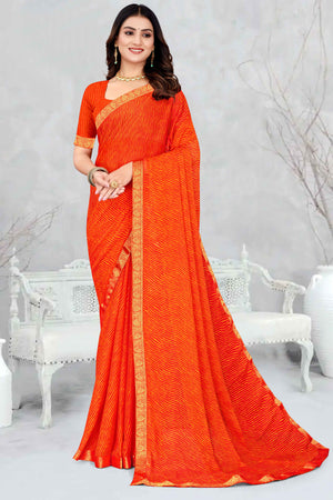 Orange Leheriya Printed Chiffon Saree Accented With A Graceful Floral Weaving Lace Border