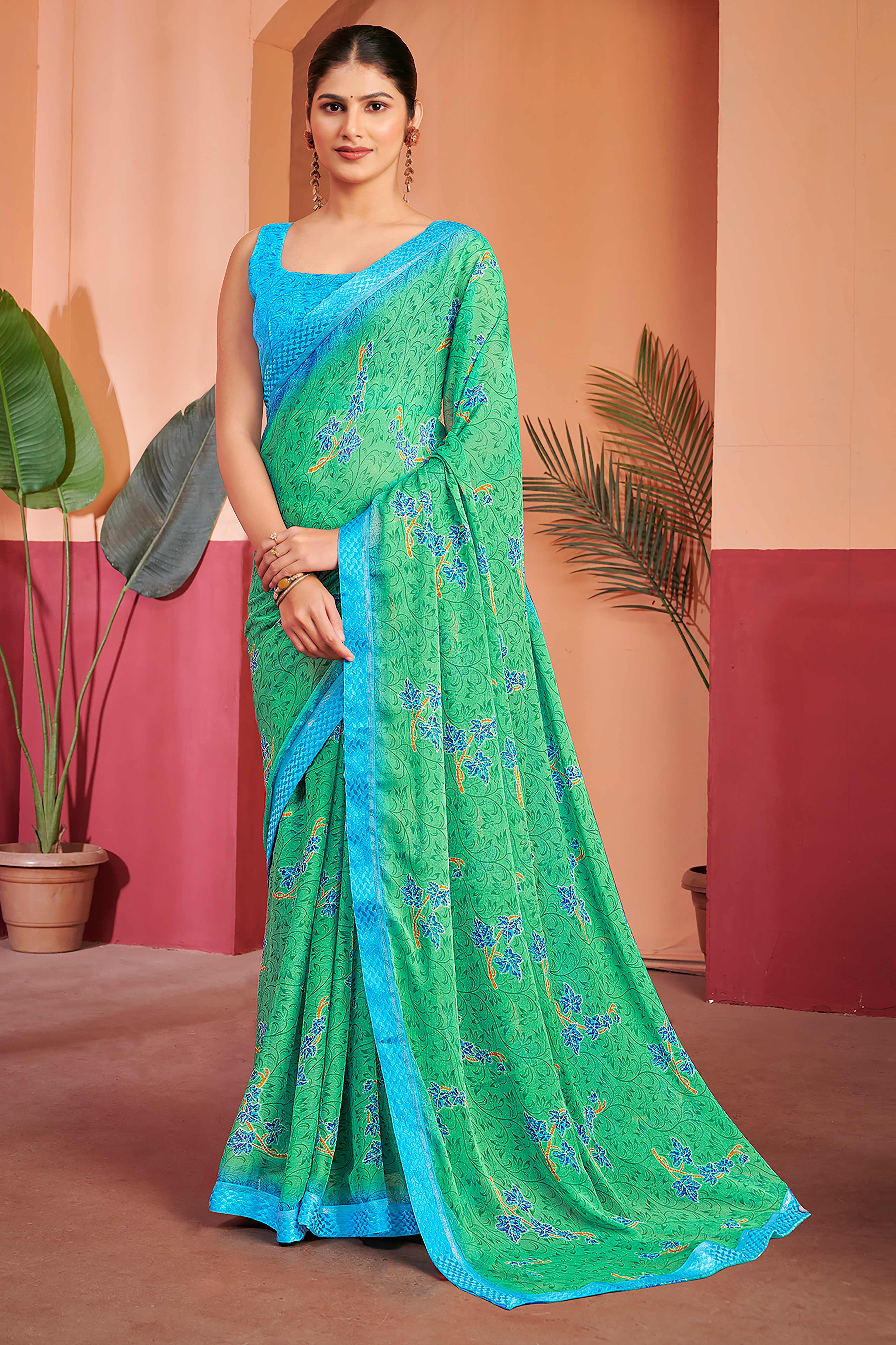 Sea Green Chiffon Saree Featuring Delicate Floral Prints & A Graceful Lace Border