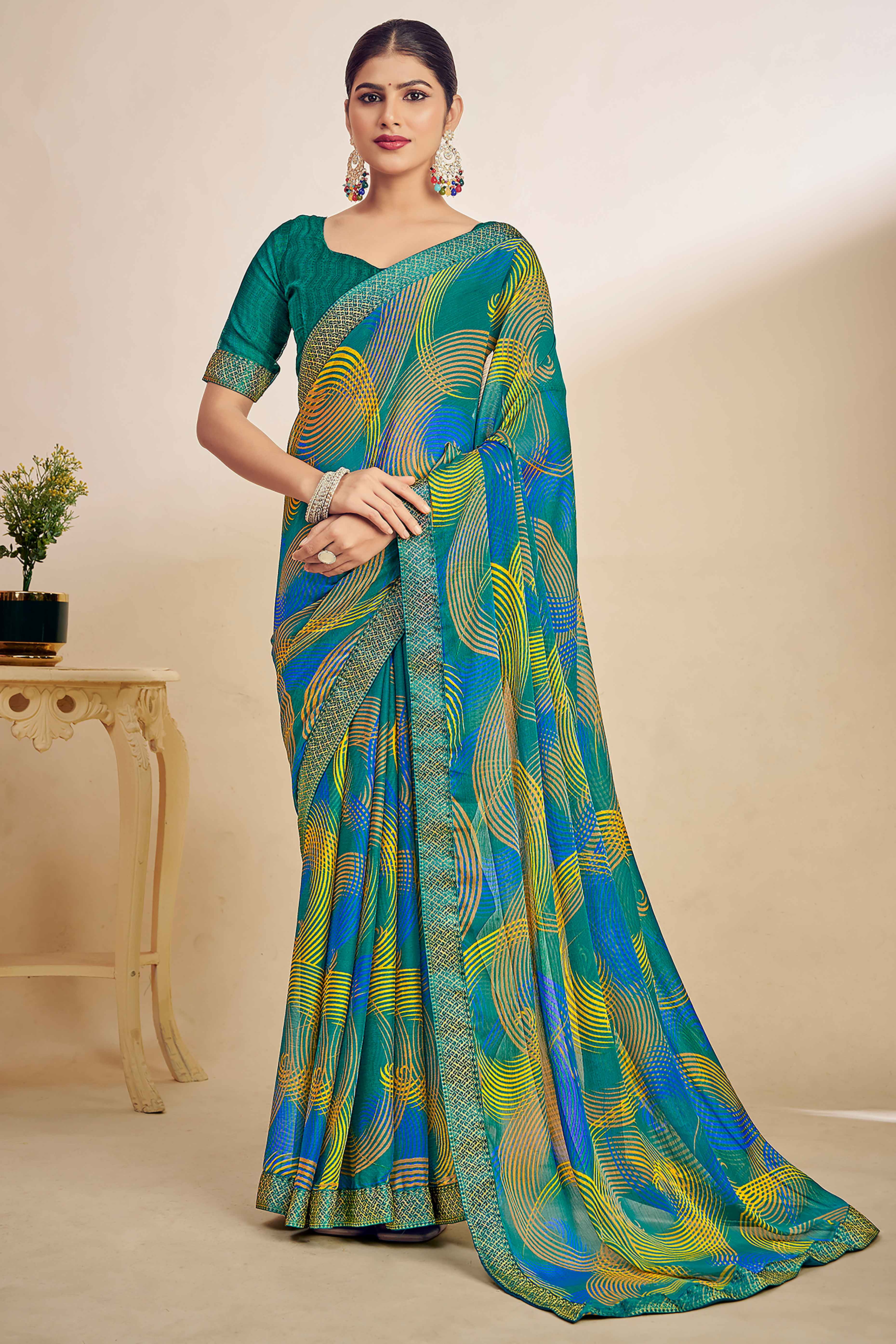 Teal Green Chiffon Saree Adorned With Artistic Print & Finely Crafted Woven Lace Border