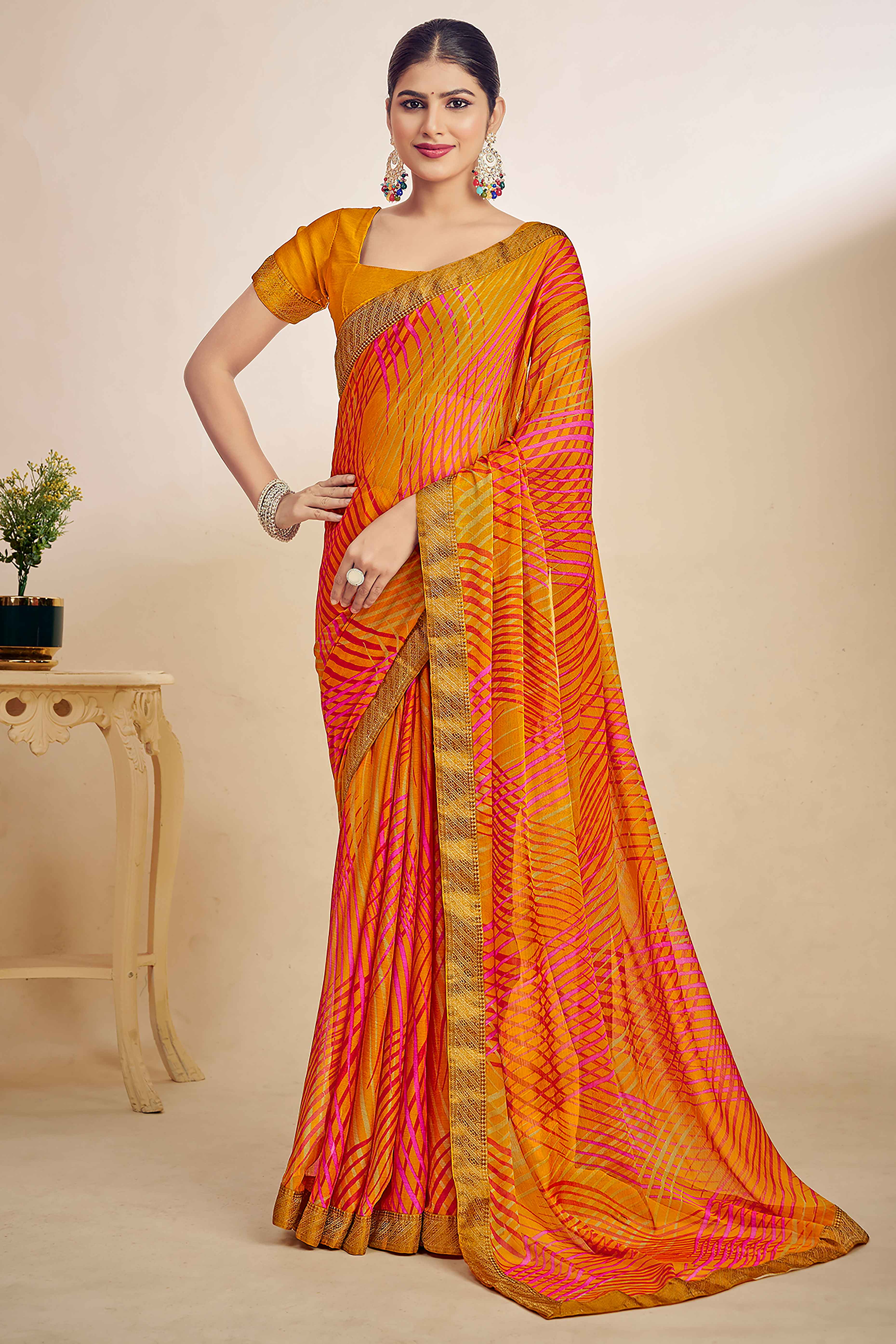 Mustard Chiffon Saree Adorned With Artistic Print & Finely Crafted Woven Lace Border