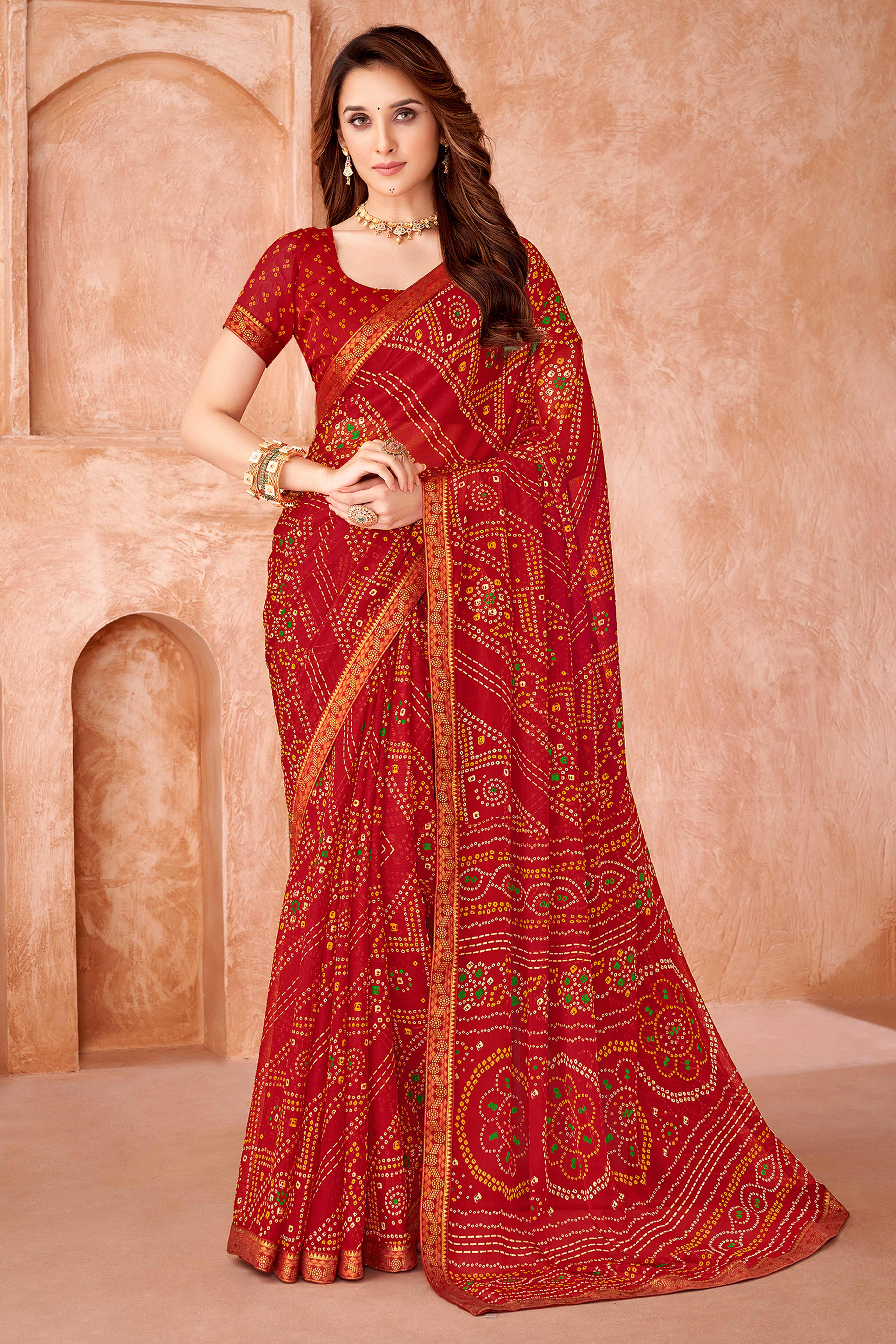 Red Chiffon Saree Featuring Traditional Bandhani Prints & A Graceful Lace Edge