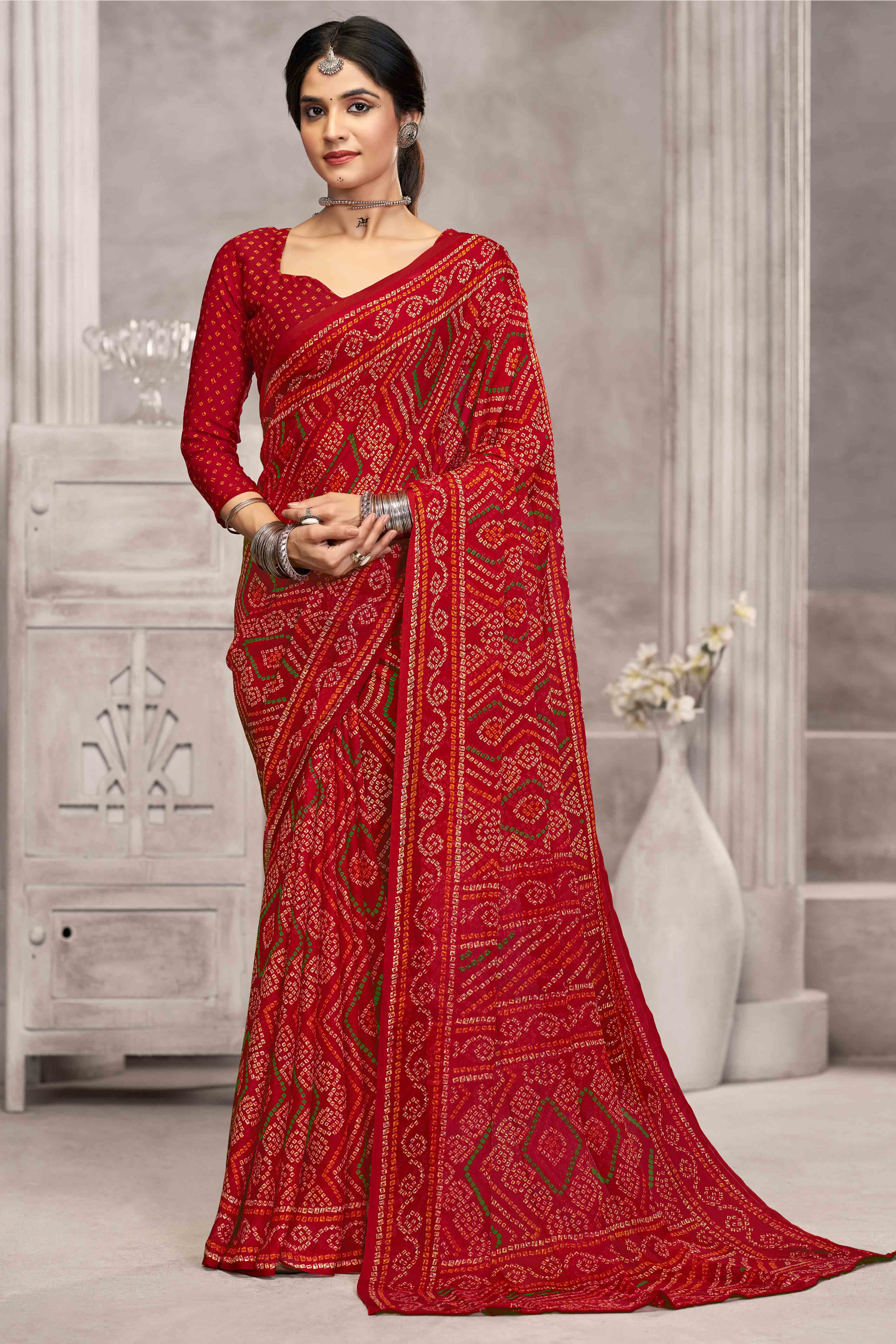 Red Chiffon Saree Features Bandhani Print for Casual Occasion