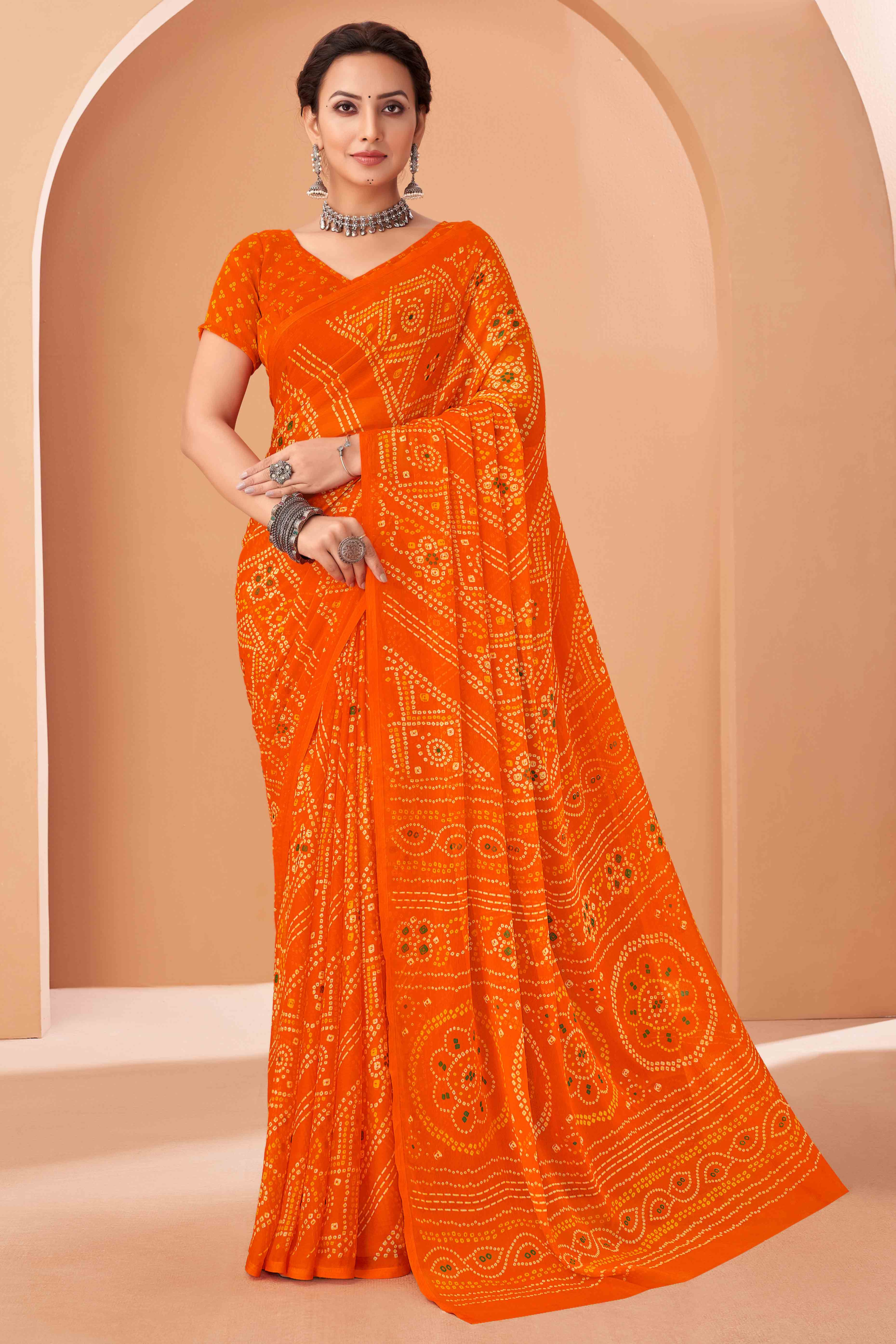 Orange Bandhani Printed Chiffon Saree Accented With Intricate Lace Border Work