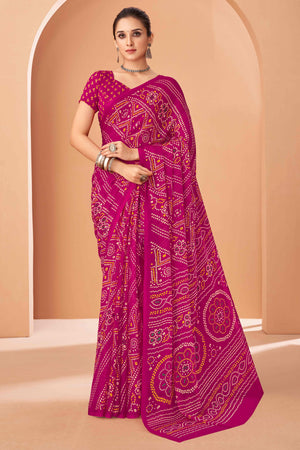 Magenta Bandhani Printed Chiffon Saree Accented With Intricate Lace Border Work