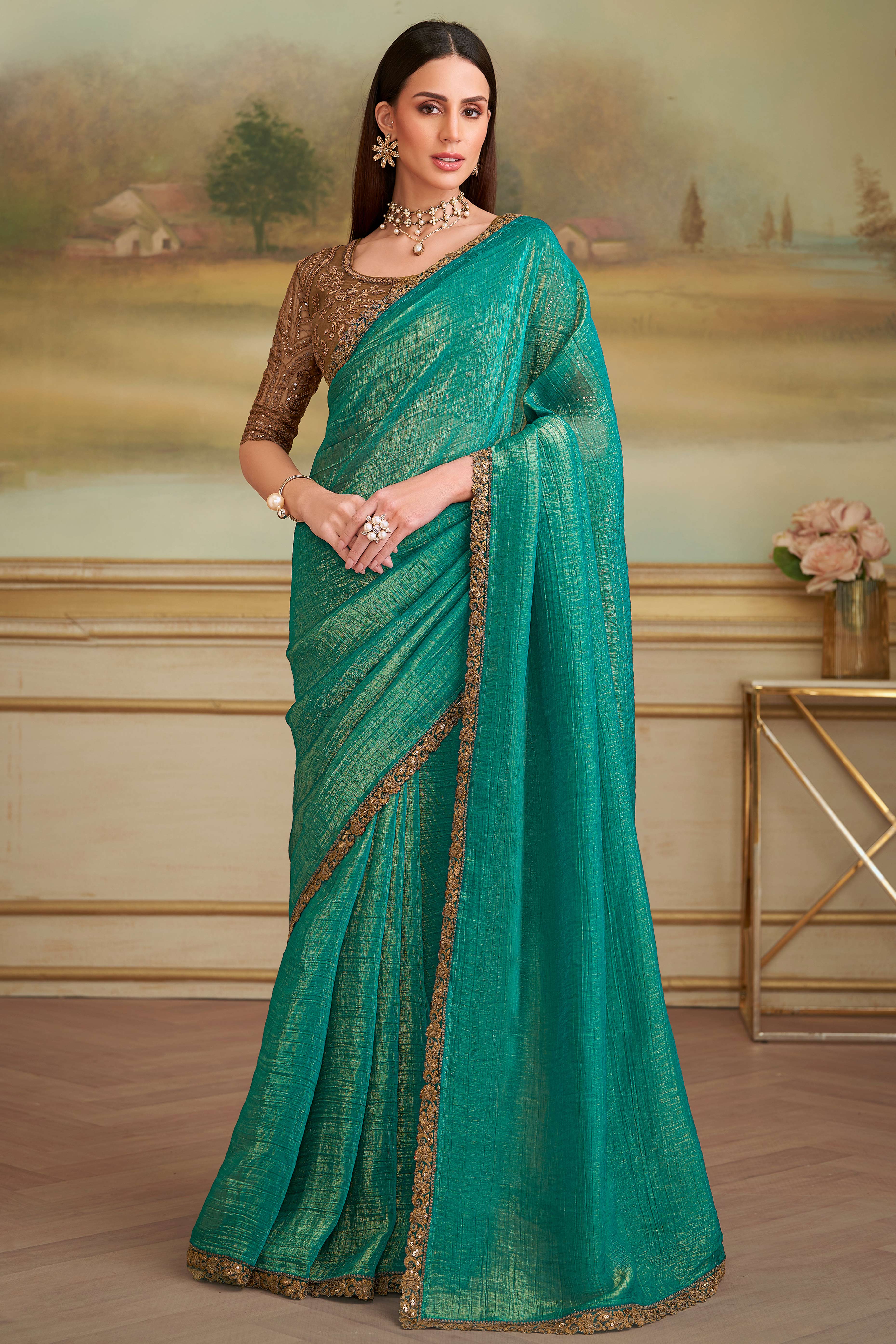Stylish Light Sea Green Georgette Saree Featuring Floral Sequins Embroidered Designer Lace Border