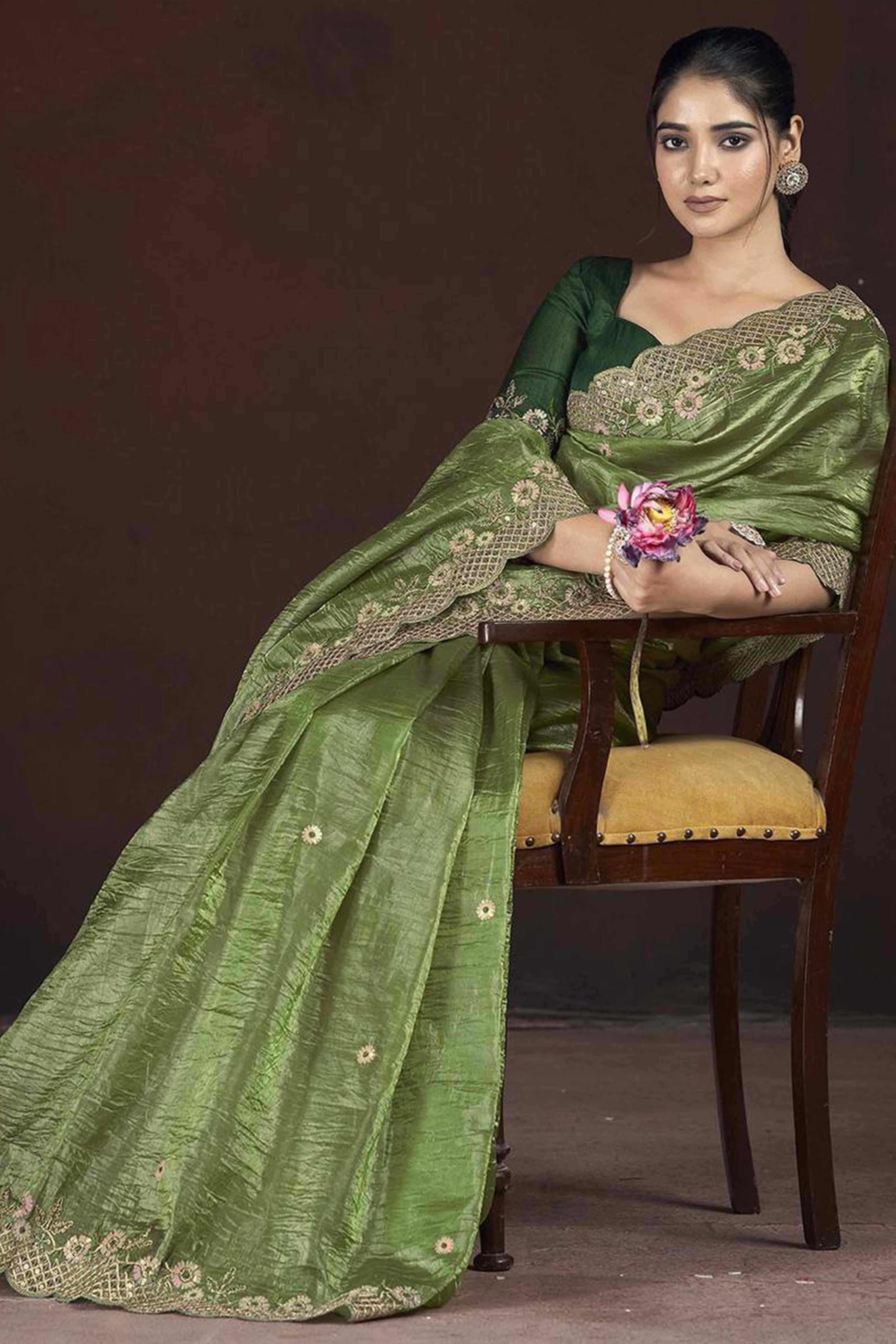 Green Organza Saree with Embroidery on the Edges for a Graceful Contemporary Look
