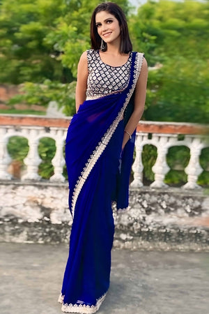Blue Georgette Saree With Sleek Solid Finish And Embroidered Edging