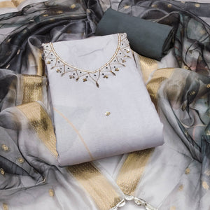 Grey Cambric Cotton Dress Material Adorned With Floral Prints & Hand Moti Embellishment