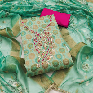 Sophisticated Turquoise Zari Woven Jacquard Dress Material Highlighted With Floral Handwork