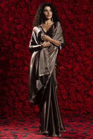 Dark Brown Solid Tissue Chiffon Saree Accentuated With A Sparkling Zarkan Work Border