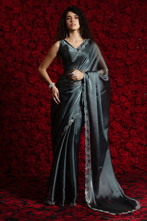 Grey Solid Tissue Chiffon Saree Accentuated With A Sparkling Zarkan Work Border