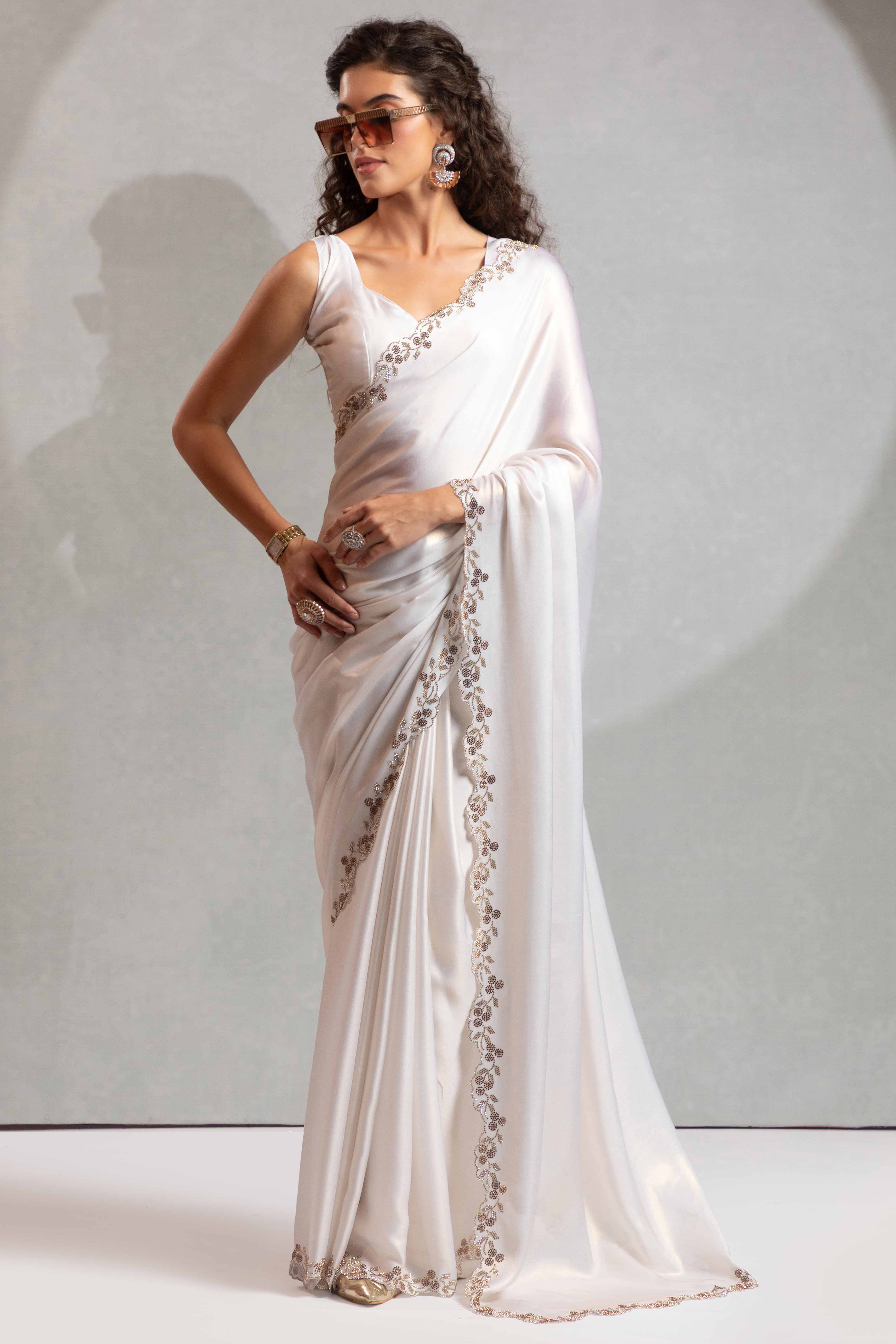 White Satin Georgette Saree Adorned With Subtle Foil Finish & A Sparkling Zarkan Work Border