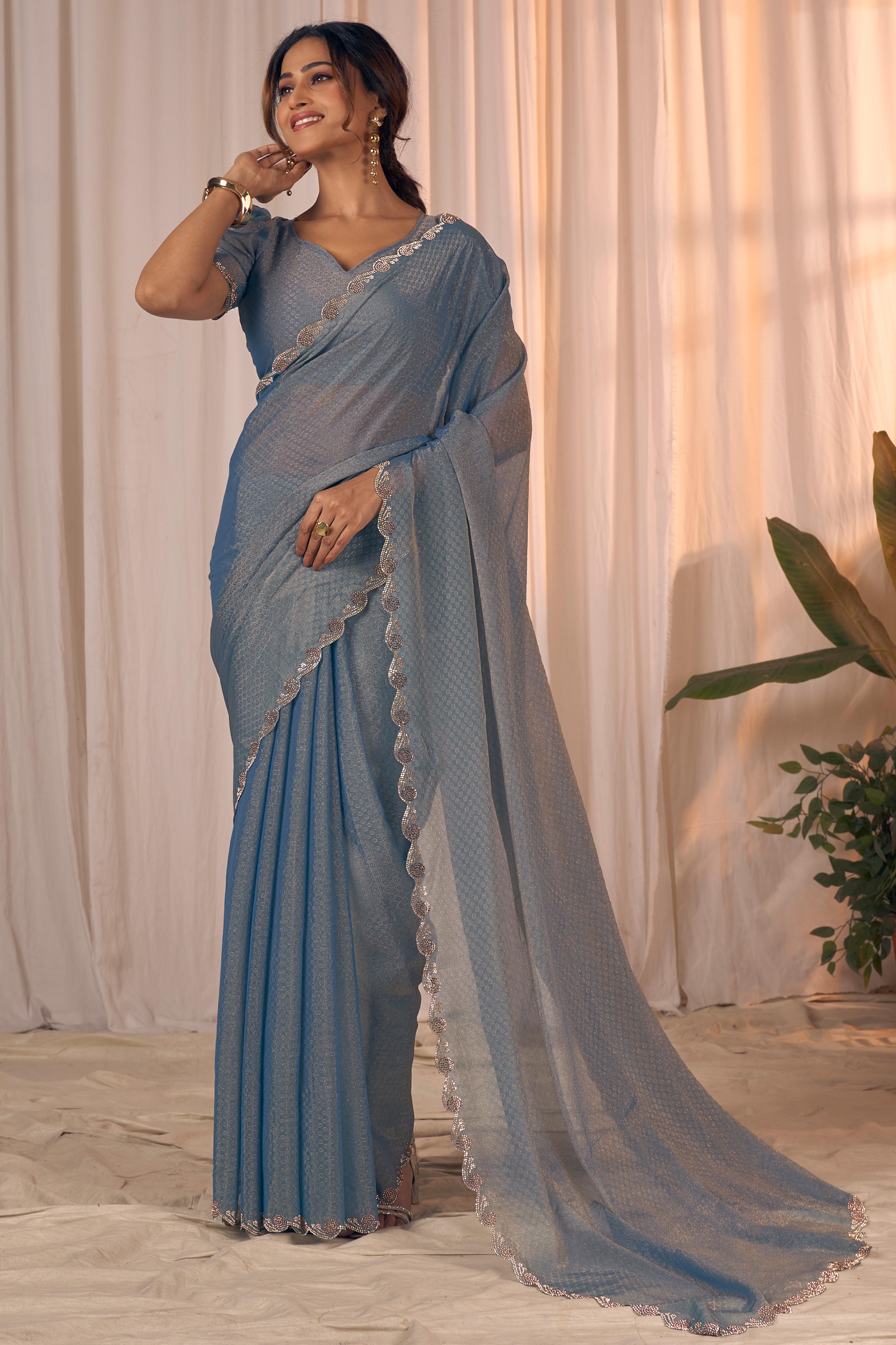 Designer Bluish Grey Georgette Saree Adorned With An Elegant Zarkan Cutwork Border