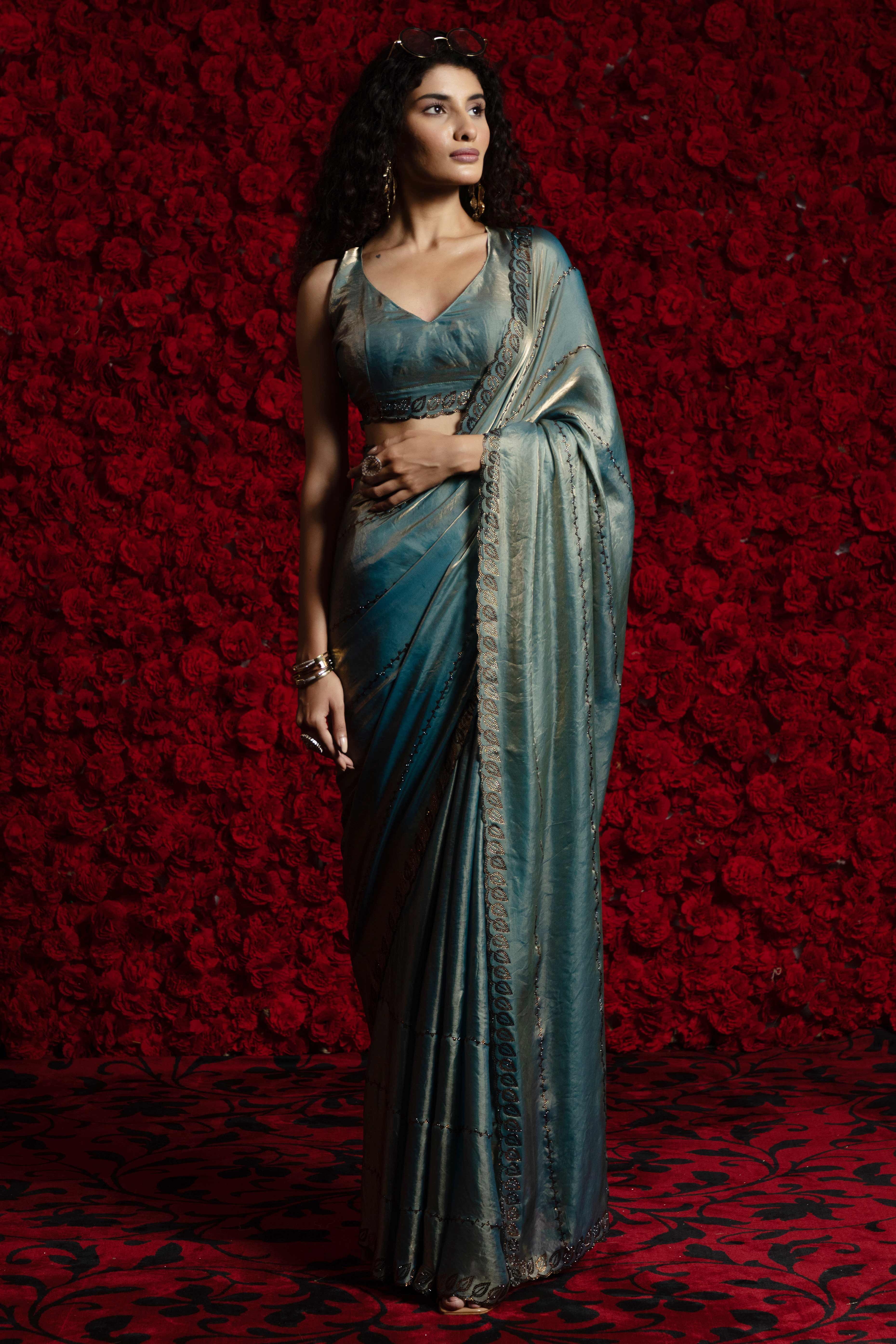 Teal Satin Silk Saree with Dazzling Stone Embellishments for Special Occasions
