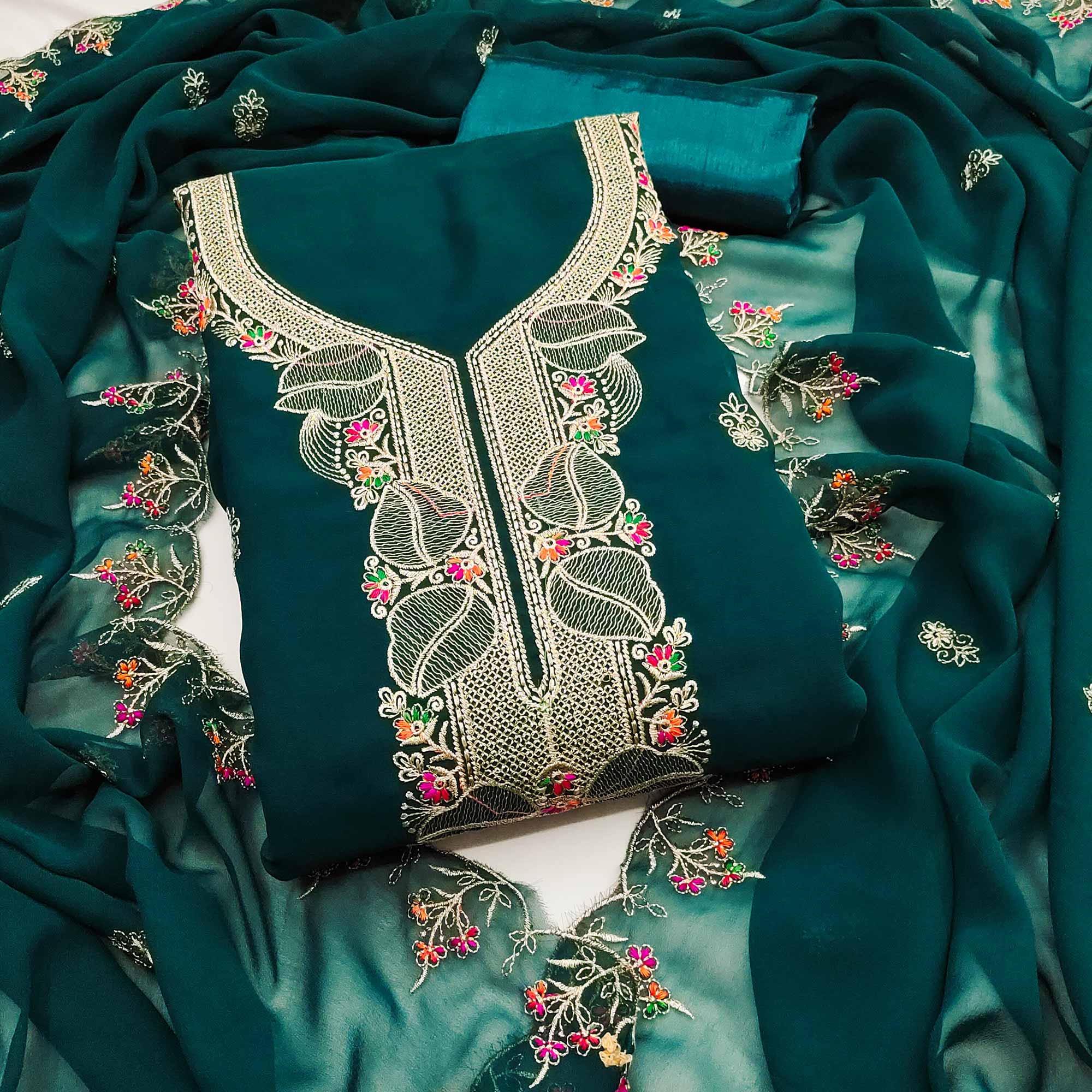 Green Georgette Dress Material Adorned With Floral Embroidery & Elegant Lace Border