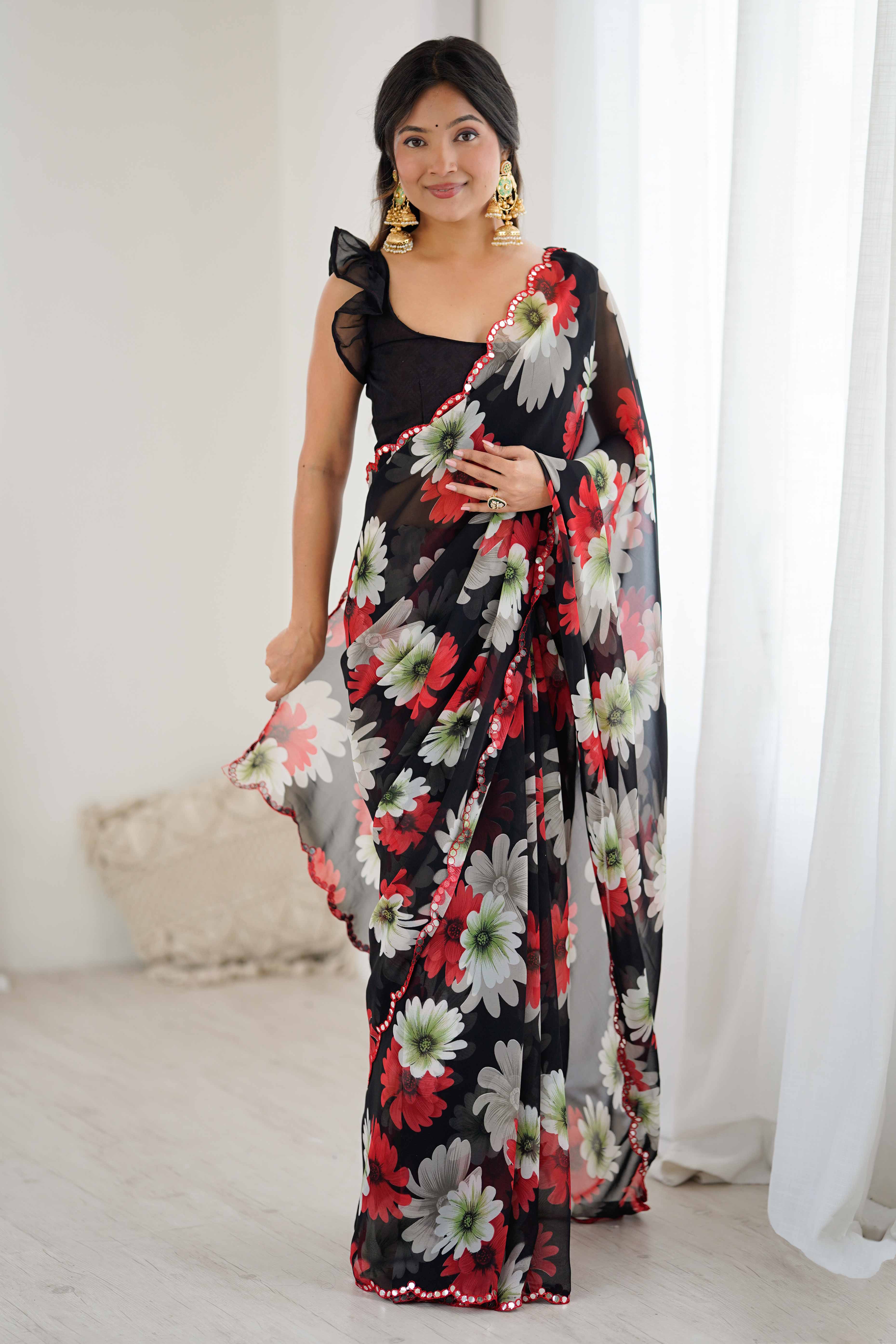 Black Georgette Saree Featuring Floral Prints & Shimmering Mirror Work Border