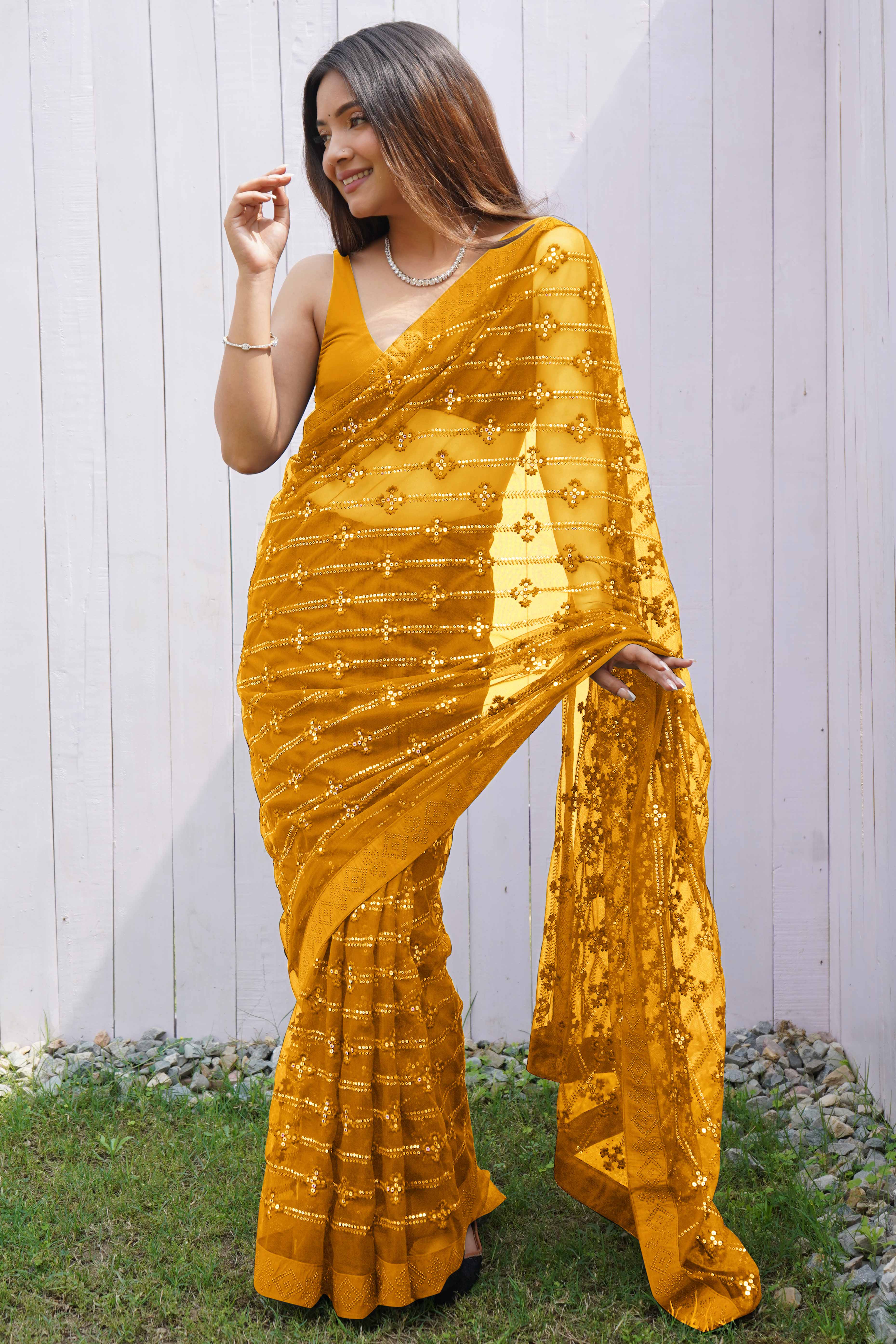 Mustard Net Saree Featuring Intricate Thread & Sequins Work With A Luxe Diamond Border