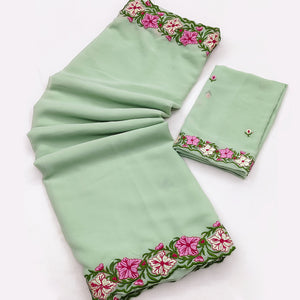 Green Faux Georgette Saree Featuring Minimalist Floral Border Embroidery