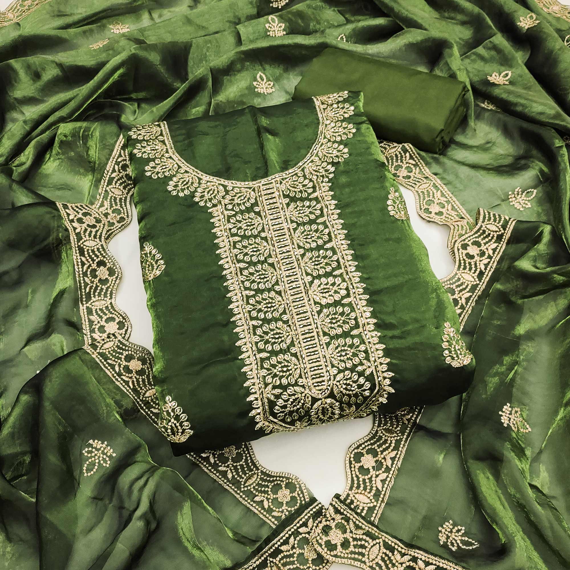 Green Satin Dress Material Adorned With Elegant Floral Zari Embroidery & Intricate Handwork