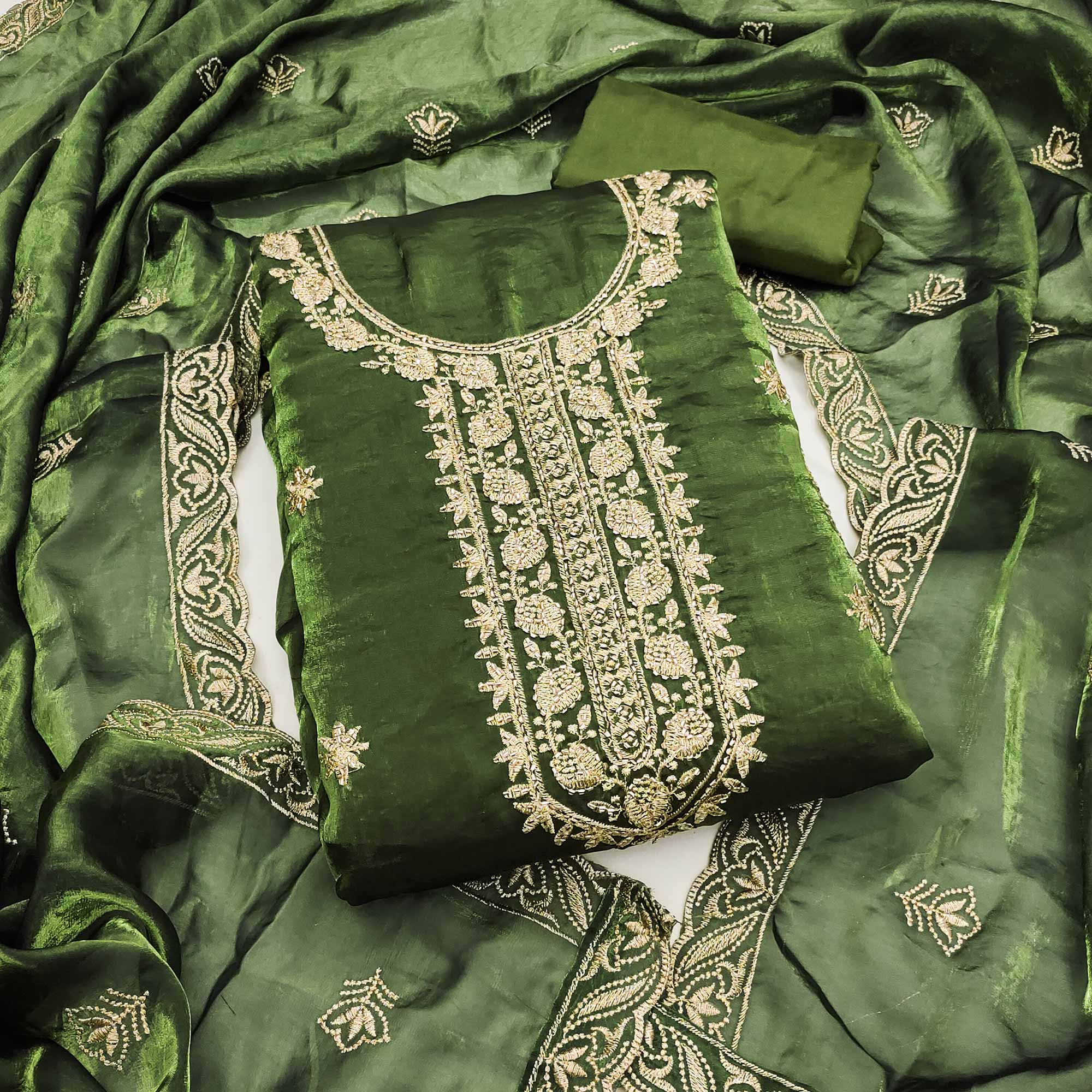 Green Satin Dress Material Featuring Exquisite Floral Embroidery With Detailed Handwork Accents