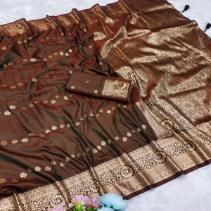 Brown Zari-Woven Cotton Silk Saree Featuring a Graceful Drape and Delicate Tassel Detailing