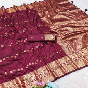 Wine Zari-Woven Cotton Silk Saree Featuring a Graceful Drape and Delicate Tassel Detailing