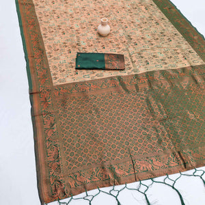 Green Classic Tissue Silk Saree Highlighted with Fine Zari Woven Motifs