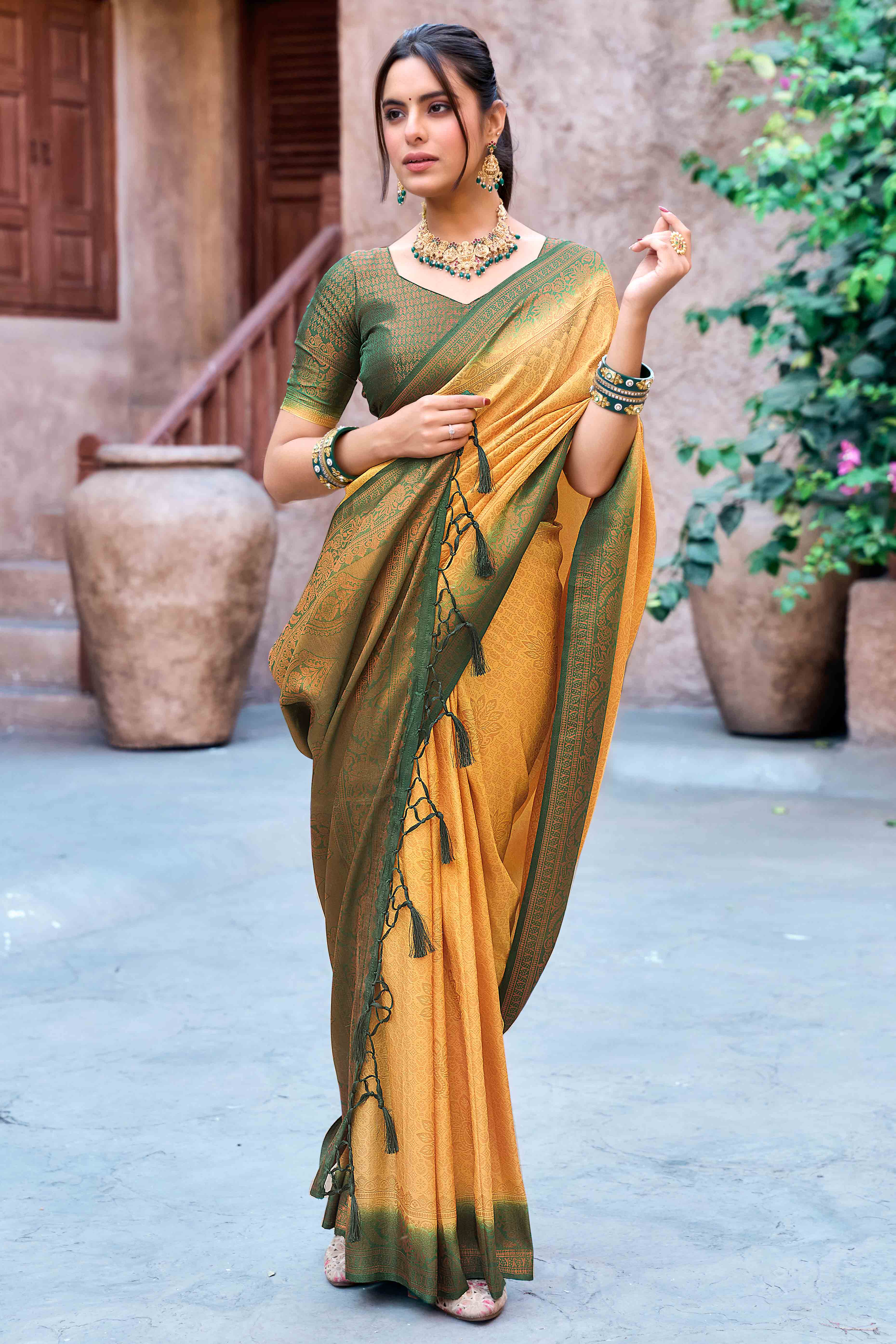 Mustard Banarasi Silk Saree Featuring Elegant Floral Woven & Delicate Tassel Edging - Image 1