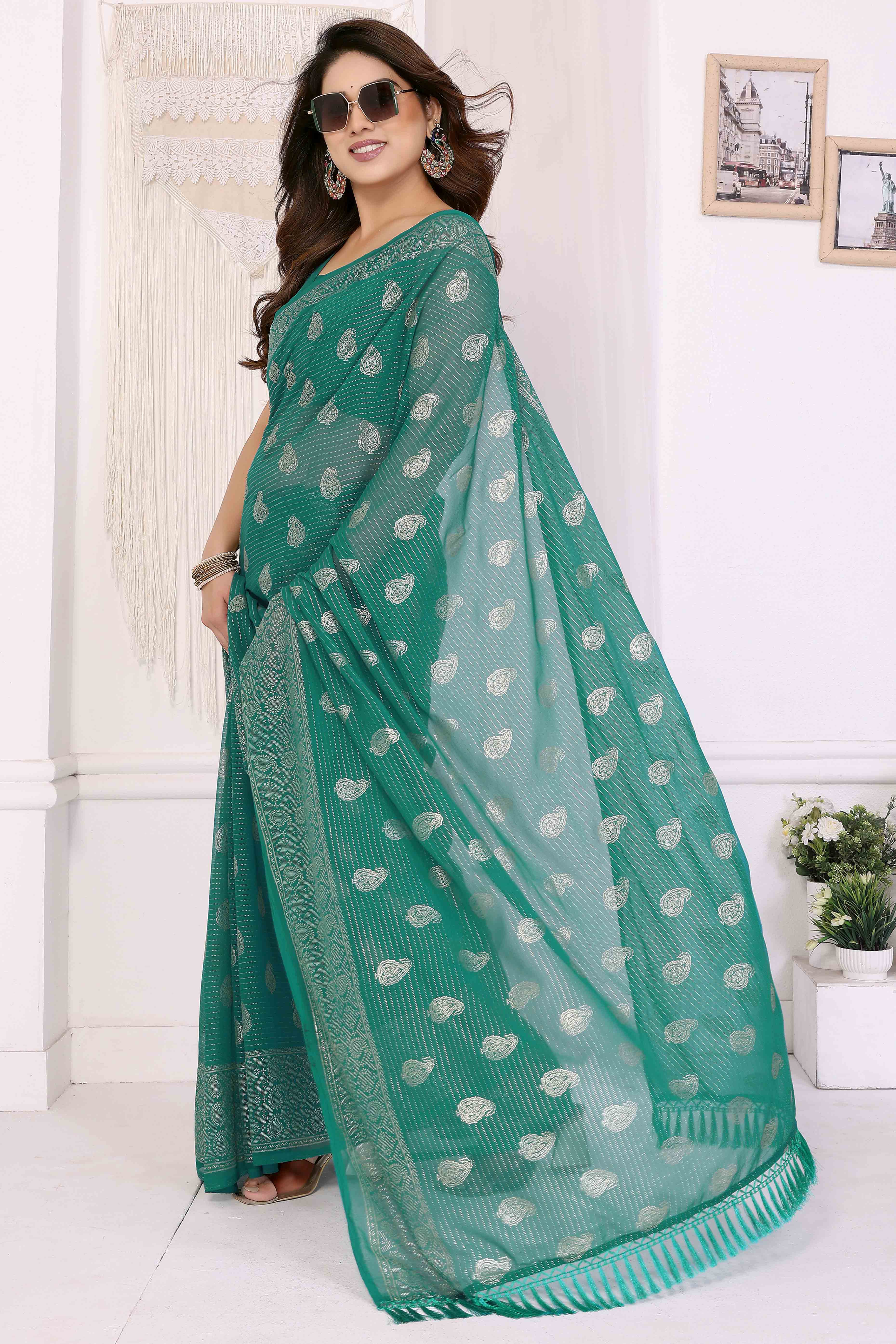 Rama Green Foil Printed Georgette Saree Enhanced With Delicate Lace Border & Elegant Tassel