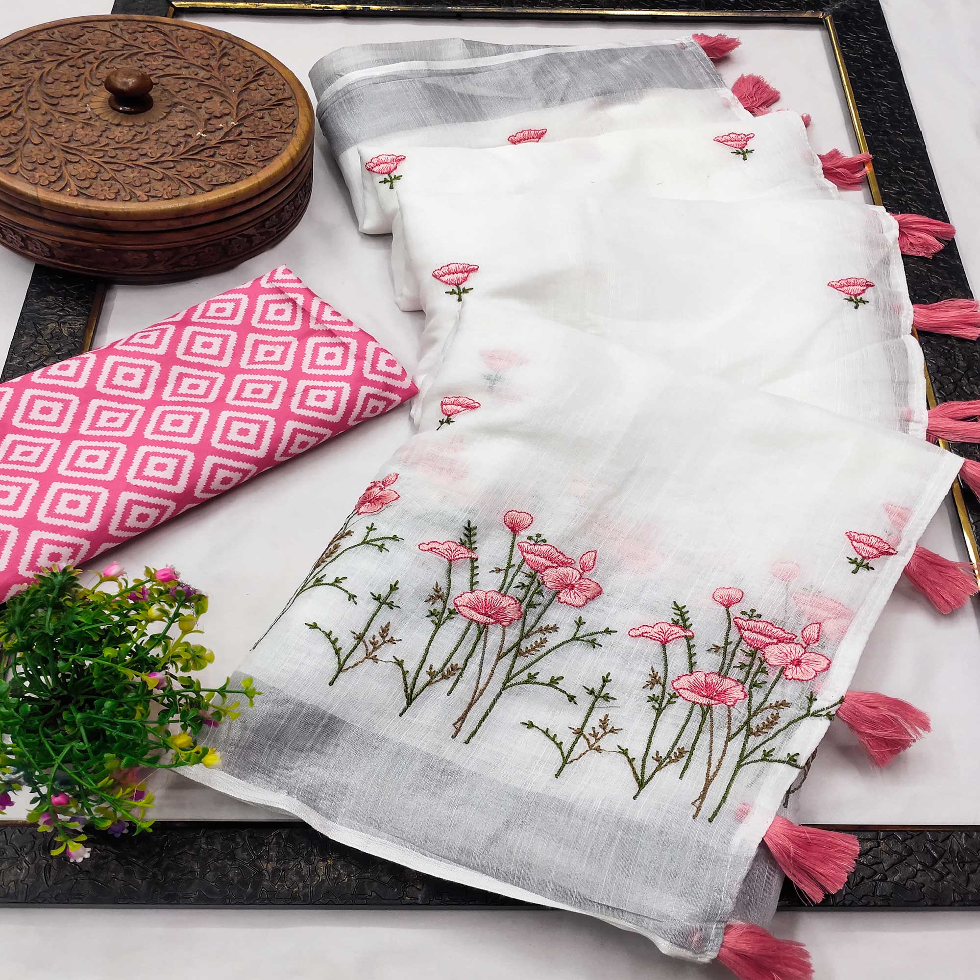 White Pure Linen Saree with Floral Embroidery and Tassel Detailing